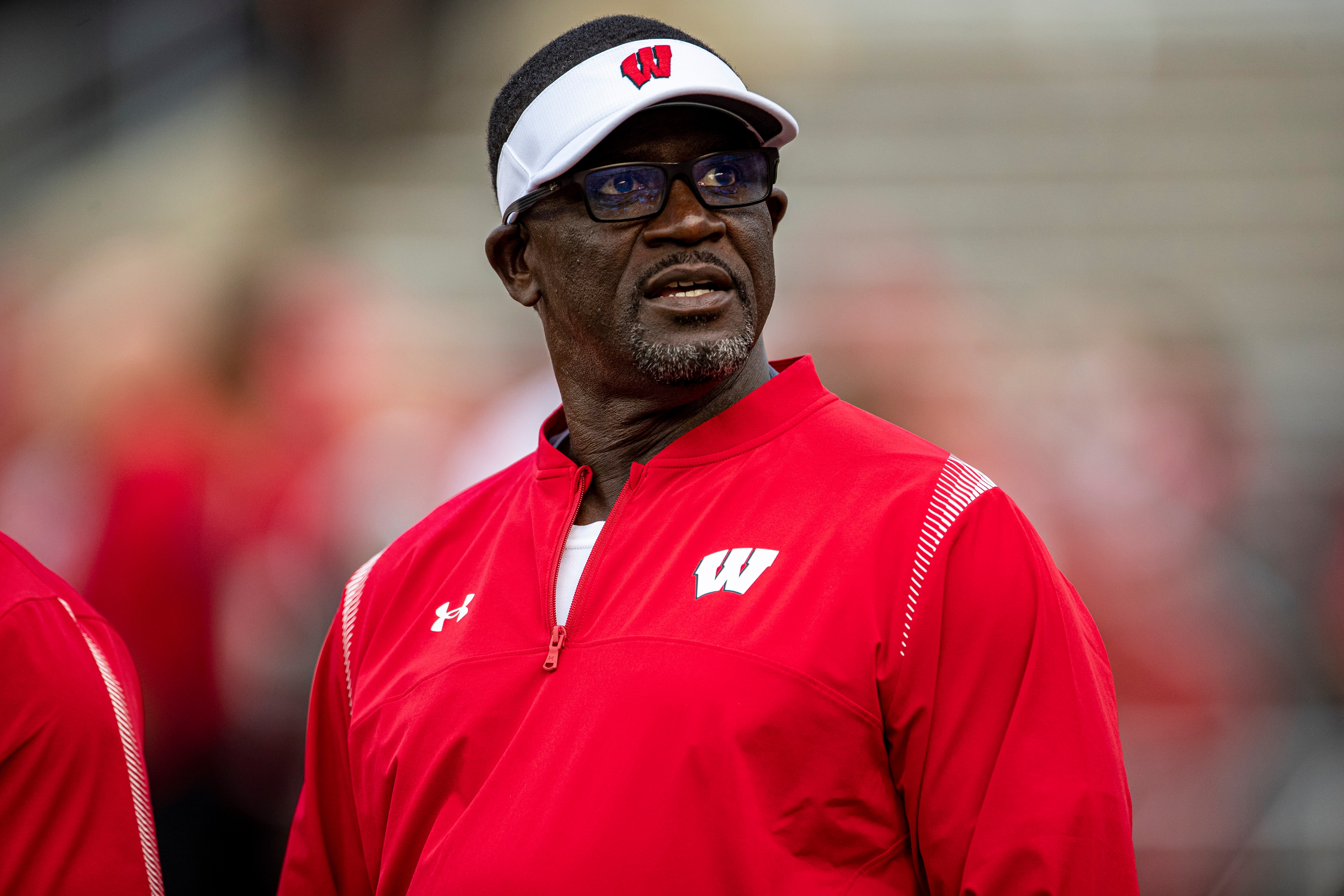 MADISON, WI - OCTOBER 02: Wisconsin Badgers Runnning Backs coach Gary Brown looks into the crowd durning warmups prior to a college football game between the Michigan Wolverines and the Wisconsin Badgers on October 2nd, 2021 at Camp Randall Stadium in Madison, WI. (Photo by Dan Sanger/Icon Sportswire via Getty Images)