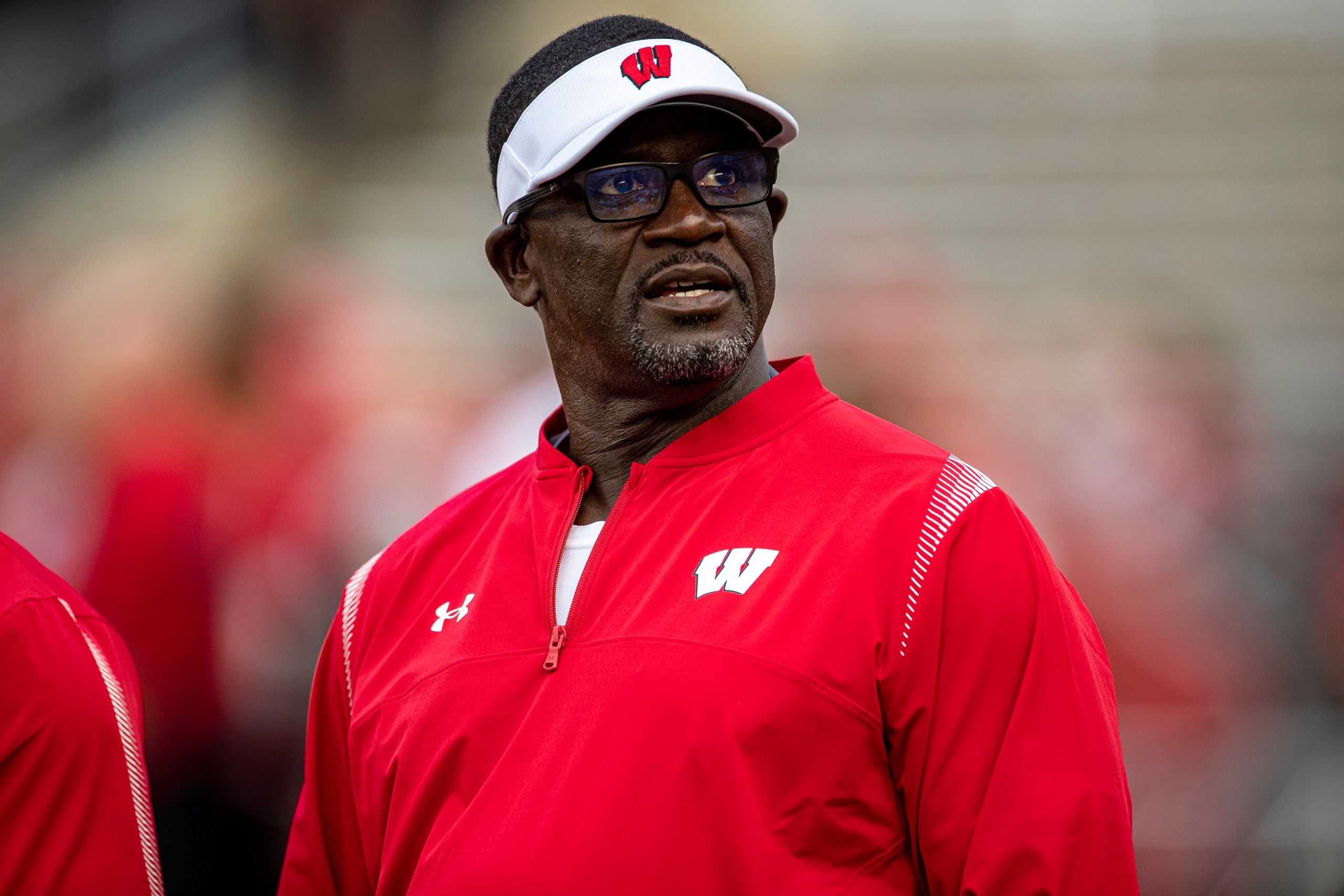 MADISON, WI - OCTOBER 02: Wisconsin Badgers Runnning Backs coach Gary Brown looks into the crowd durning warmups prior to a college football game between the Michigan Wolverines and the Wisconsin Badgers on October 2nd, 2021 at Camp Randall Stadium in Madison, WI. (Photo by Dan Sanger/Icon Sportswire via Getty Images)