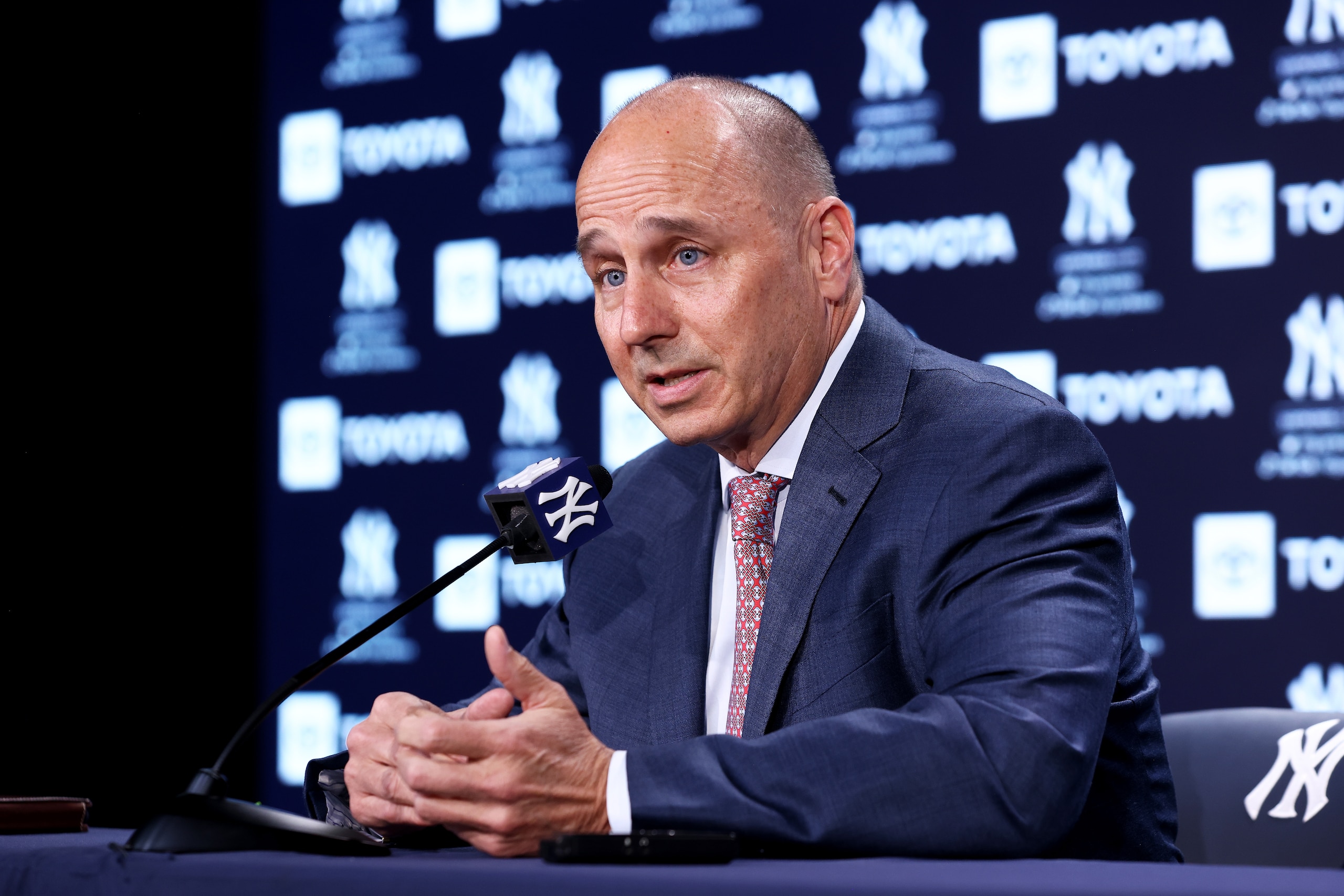 NEW YORK, NEW YORK - APRIL 08: New York Yankees General Manager Brian Cashman speaks to the media prior to the start of the game against the Boston Red Sox at Yankee Stadium on April 08, 2022 in New York City. (Photo by Mike Stobe/Getty Images)