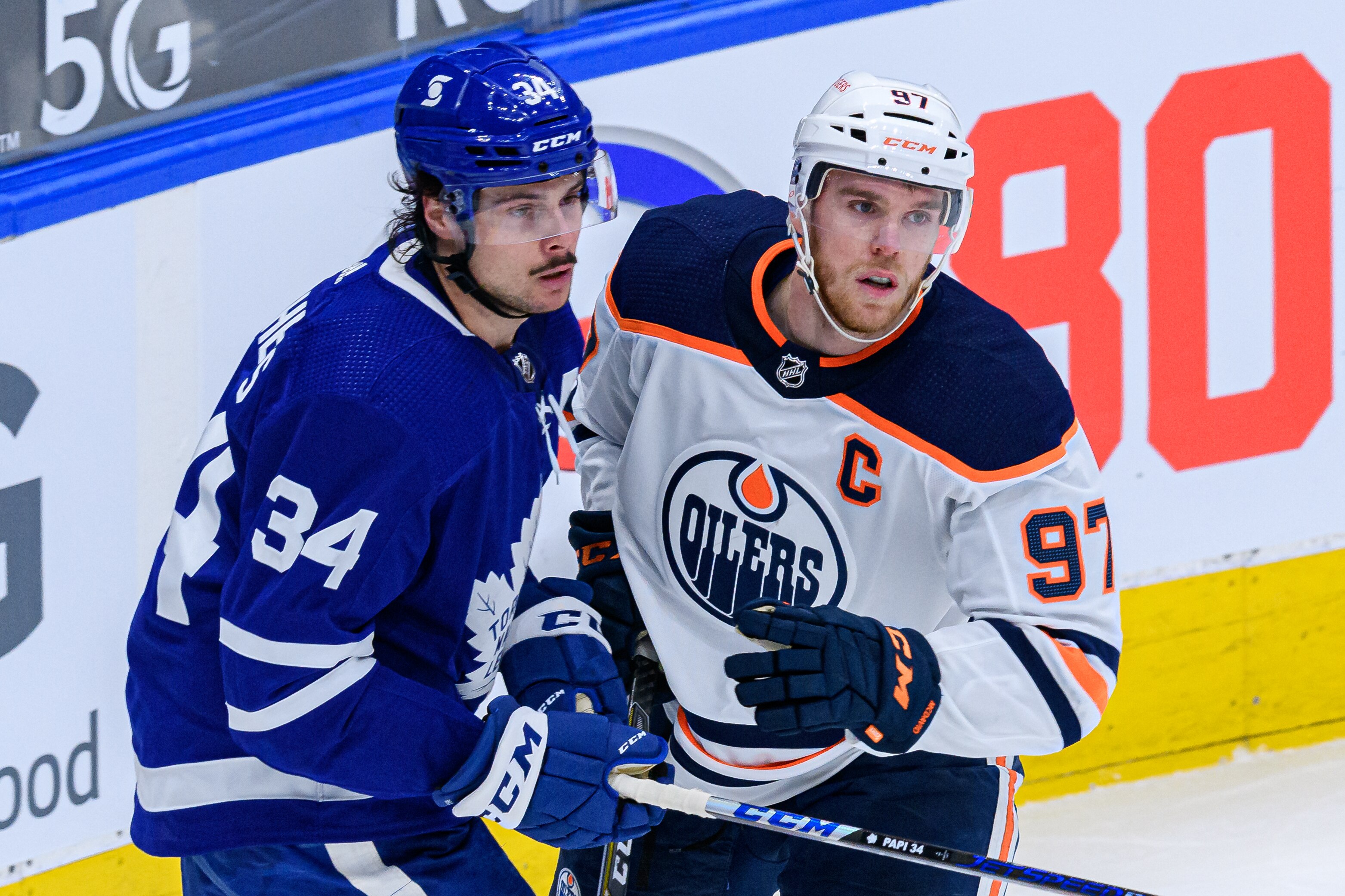 TORONTO, ON - MARCH 29: Toronto Maple Leafs Center Auston Matthews (34) and Edmonton Oilers Center Connor McDavid (97) react during the second period of the NHL regular season game between the Edmonton Oilers and the Toronto Maple Leafs on March 29, 2021, at Scotiabank Arena in Toronto, ON, Canada. (Photo by Julian Avram/Icon Sportswire via Getty Images)