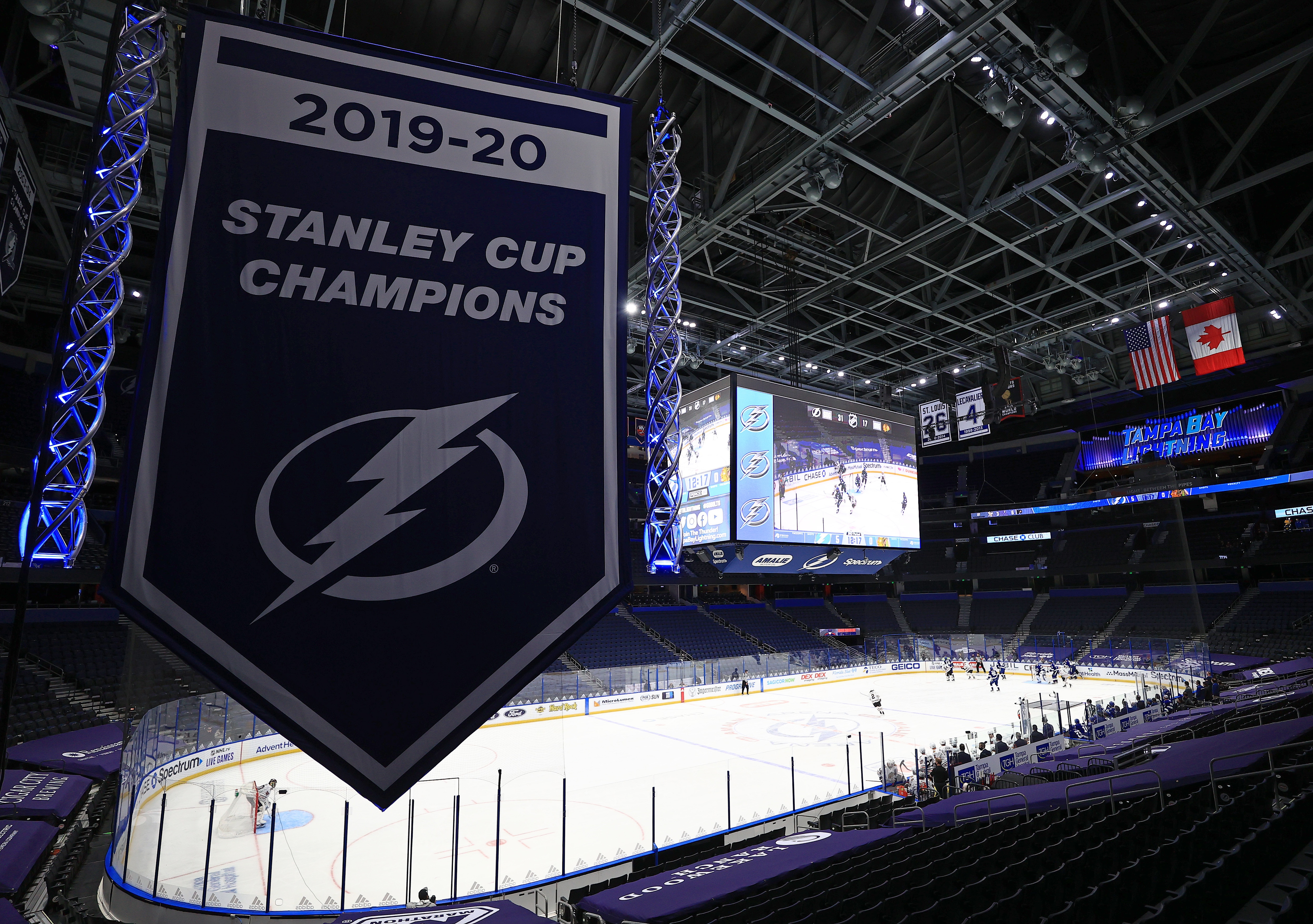 TAMPA, FLORIDA - JANUARY 13: The Tampa Bay Lightning raise the banner celebrating winning the Stanley Cup for the 2019-20 NHL season during a game against the Chicago Blackhawks on opening night of the 2020-21 NHL season  at Amalie Arena on January 13, 2021 in Tampa, Florida. (Photo by Mike Ehrmann/Getty Images)