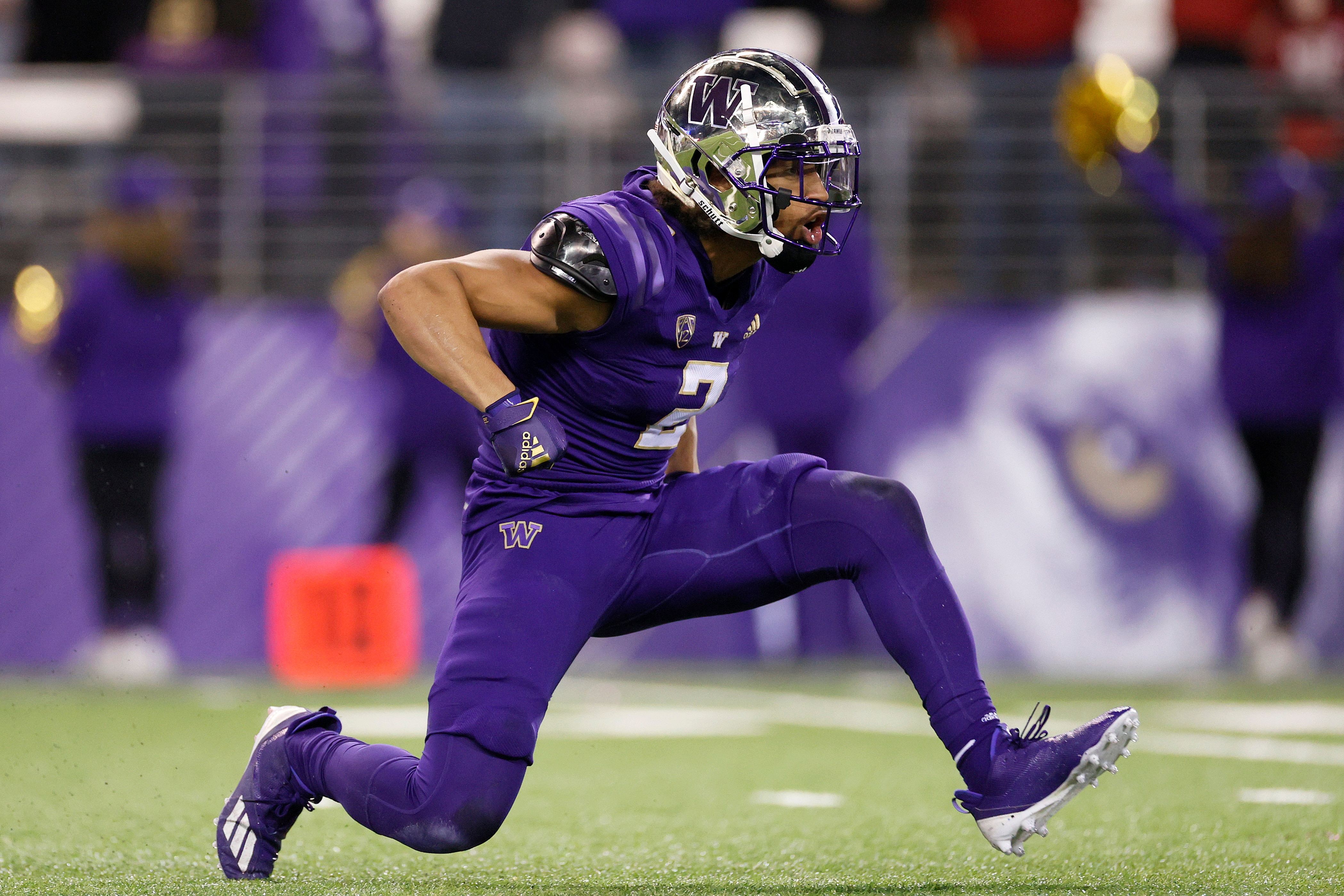 SEATTLE, WASHINGTON - NOVEMBER 26: Kyler Gordon #2 of the Washington Huskies reacts after a stop against the Washington State Cougars during the first quarter at Husky Stadium on November 26, 2021 in Seattle, Washington. (Photo by Steph Chambers/Getty Images)