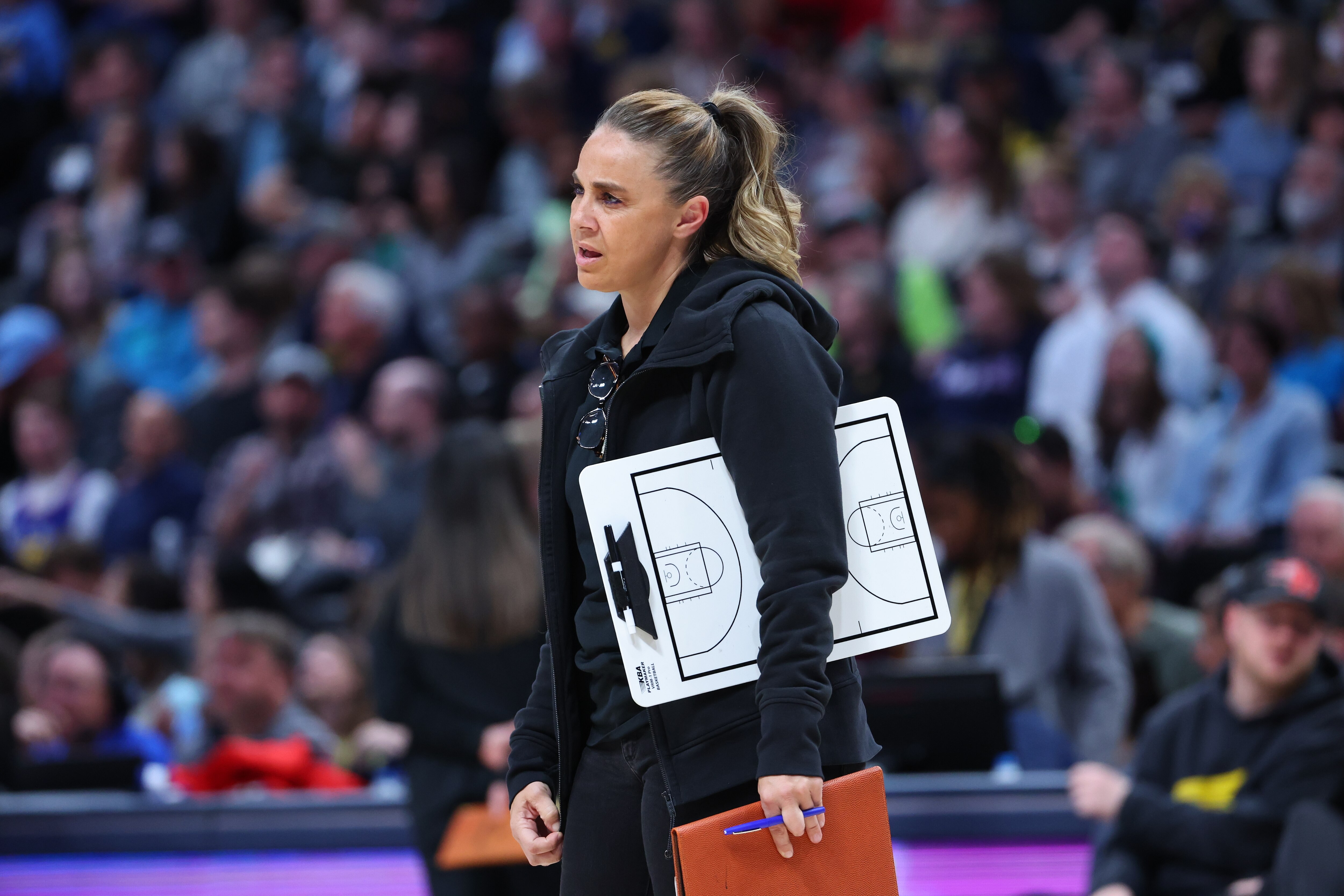 DENVER, CO - APRIL 05: Assistant coach Becky Hammon of the San Antonio Spurs looks on against the Denver Nuggets during the third quarter at Ball Arena on April 5, 2022 in Denver, Colorado.  NOTE TO USER: User expressly acknowledges and agrees that, by downloading and or using this photograph, User is consenting to the terms and conditions of the Getty Images License Agreement. (Photo by C. Morgan Engel/Getty Images)