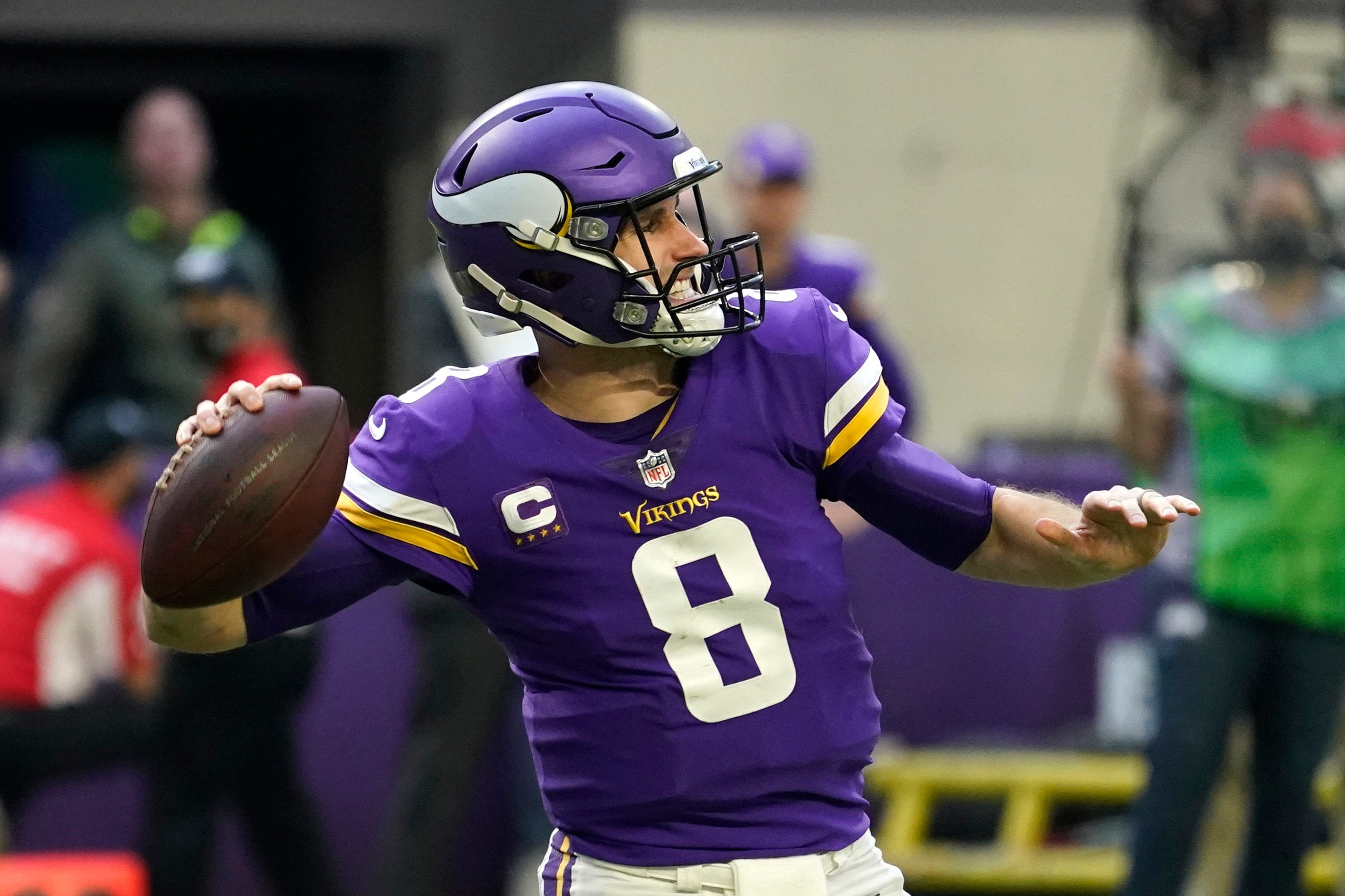 Minnesota Vikings quarterback Kirk Cousins (8) throws a pass during the first half of an NFL football game against the Chicago Bears, Sunday, Jan. 9, 2022, in Minneapolis. (AP Photo/Jim Mone)