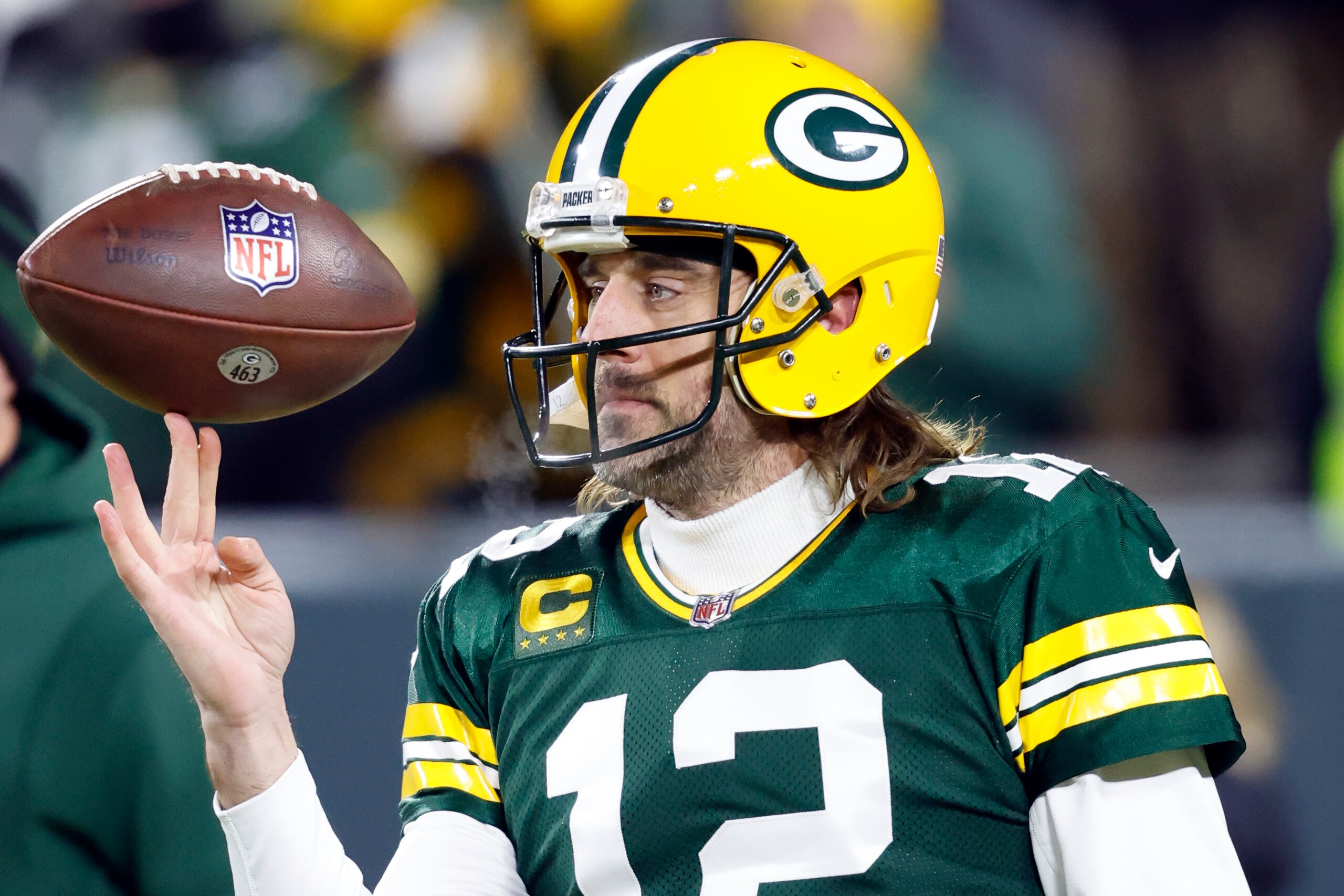 FILE - Green Bay Packers quarterback Aaron Rodgers (12) spins a football in his fingers before an NFL divisional playoff football game against the San Francisco 49ers, on Jan 22. 2022, in Green Bay, Wis. An underwhelming free agent class for quarterbacks is overshadowed by the possibility of multiple big names changing teams, most notably Aaron Rodgers. (AP Photo/Jeffrey Phelps, File) FILE - Green Bay Packers quarterback Aaron Rodgers (12) spins a football in his fingers before an NFL divisional playoff football game against the San Francisco 49ers, on Jan 22. 2022, in Green Bay, Wis. An underwhelming free agent class for quarterbacks is overshadowed by the possibility of multiple big names changing teams, most notably Aaron Rodgers. (AP Photo/Jeffrey Phelps, File)