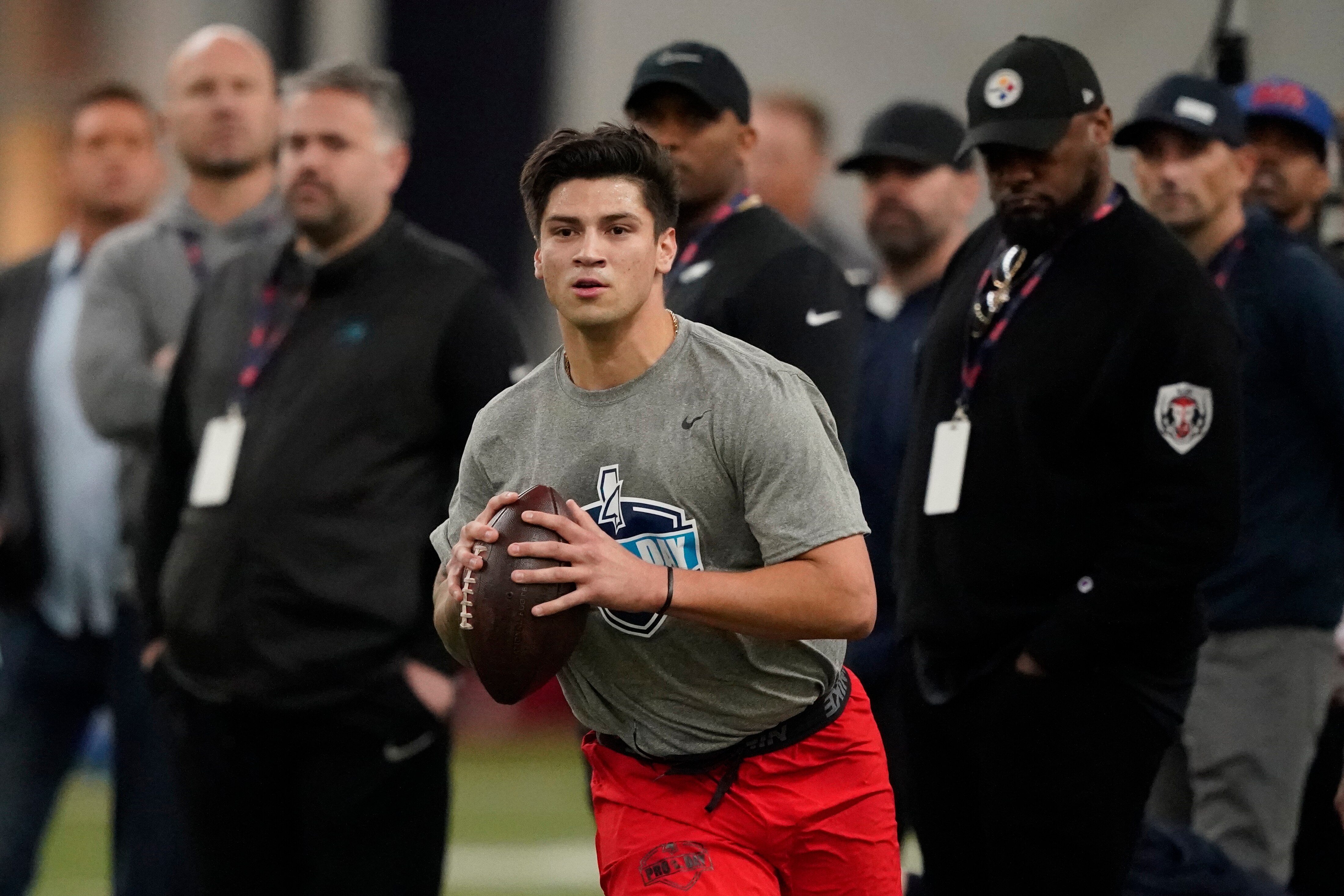 Quarterback Matt Corral sets up to pass during a football drill at the Mississippi Pro Day in Oxford, Miss., Wednesday, March 23, 2022. (AP Photo/Rogelio V. Solis)