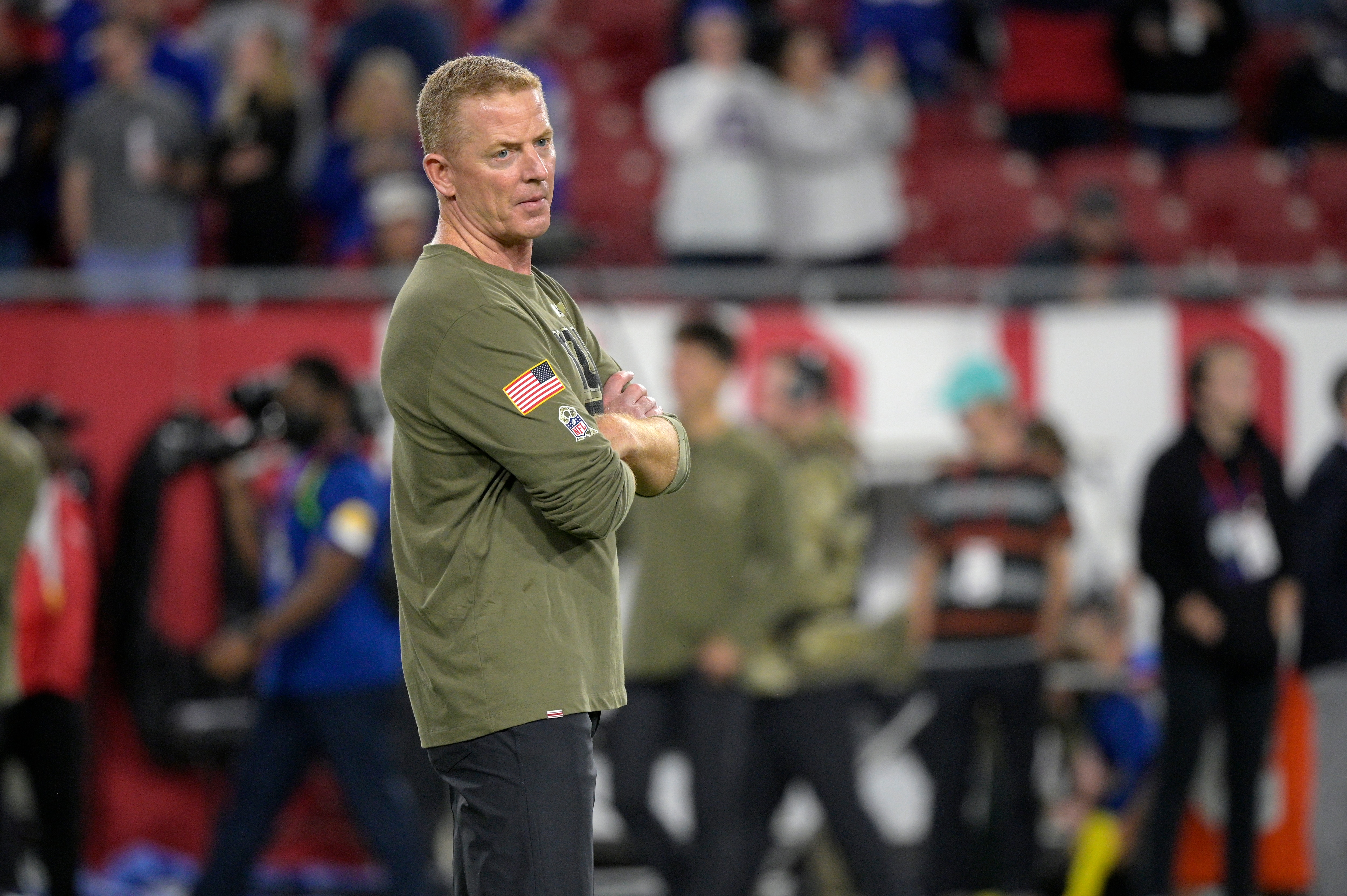 New York Giants offensive coordinator Jason Garrett watches players warm up before an NFL football game against the Tampa Bay Buccaneers, Monday, Nov. 22, 2021, in Tampa, Fla. (AP Photo/Phelan M. Ebenhack)
