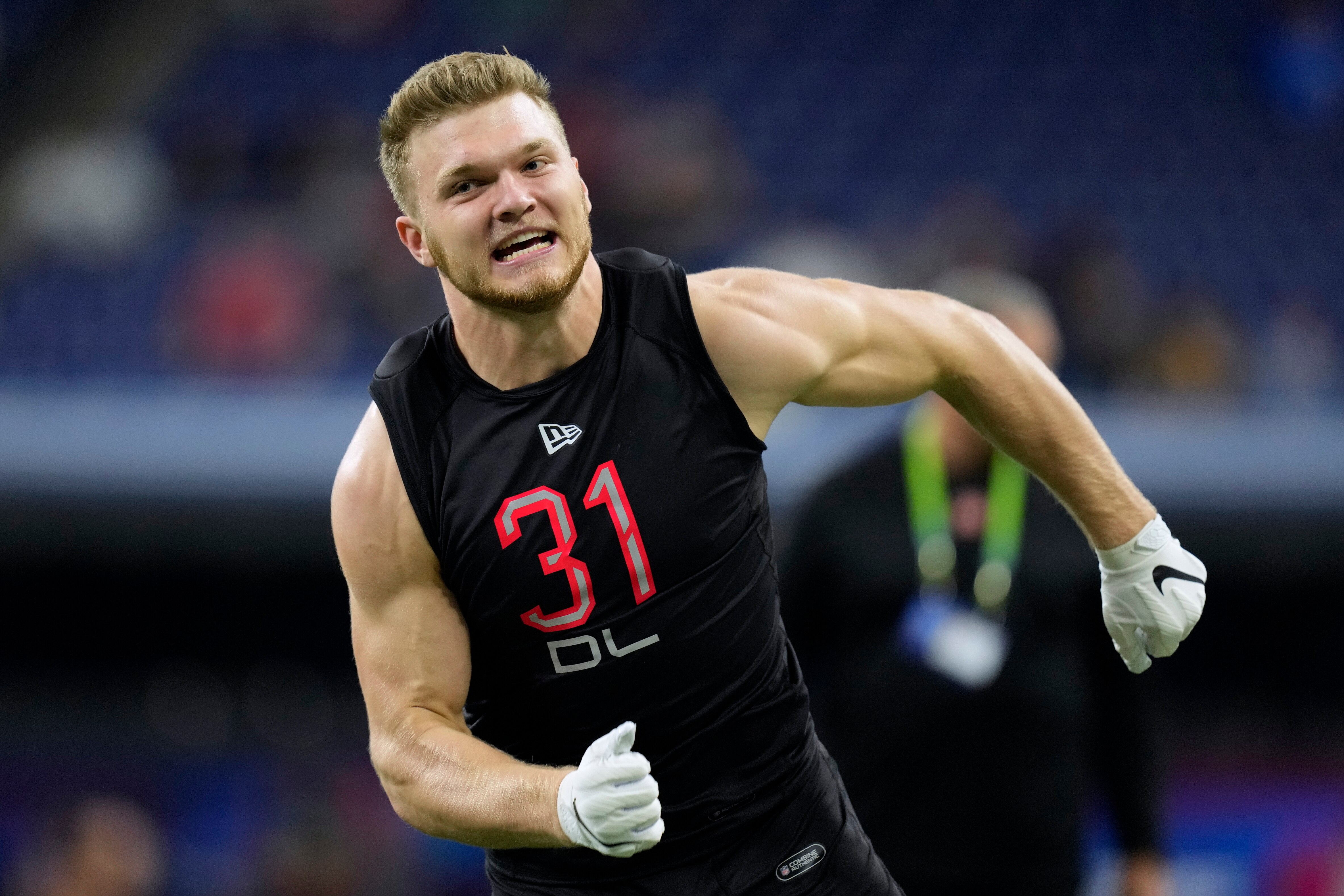 Michigan defensive lineman Aidan Hutchinson runs during a drill at the NFL football scouting combine, Saturday, March 5, 2022, in Indianapolis. (AP Photo/Charlie Neibergall)