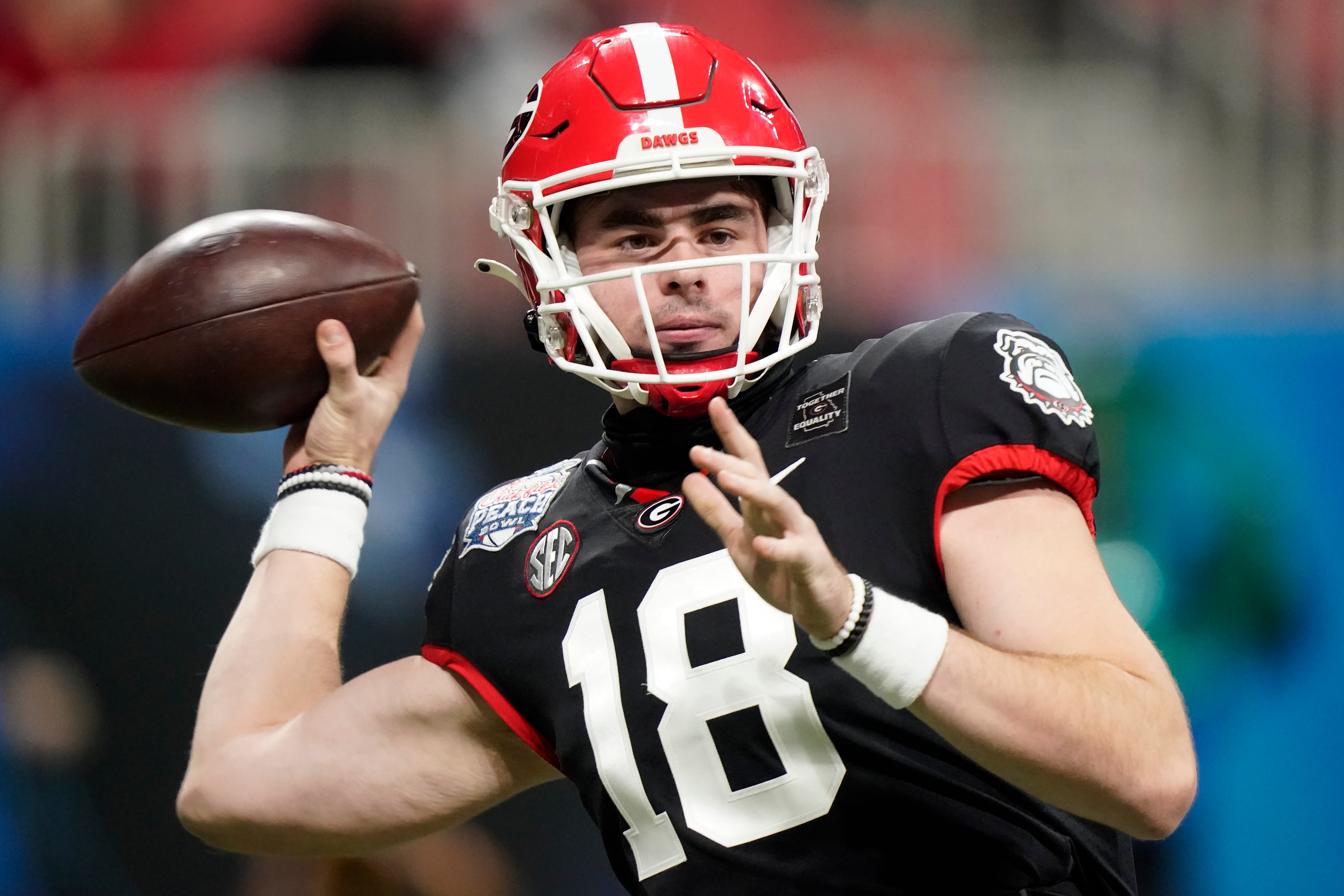 Georgia quarterback JT Daniels (18) works against Cincinnati during the first half of the Peach Bowl NCAA college football game, Friday, Jan. 1, 2021, in Atlanta. (AP Photo/Brynn Anderson)