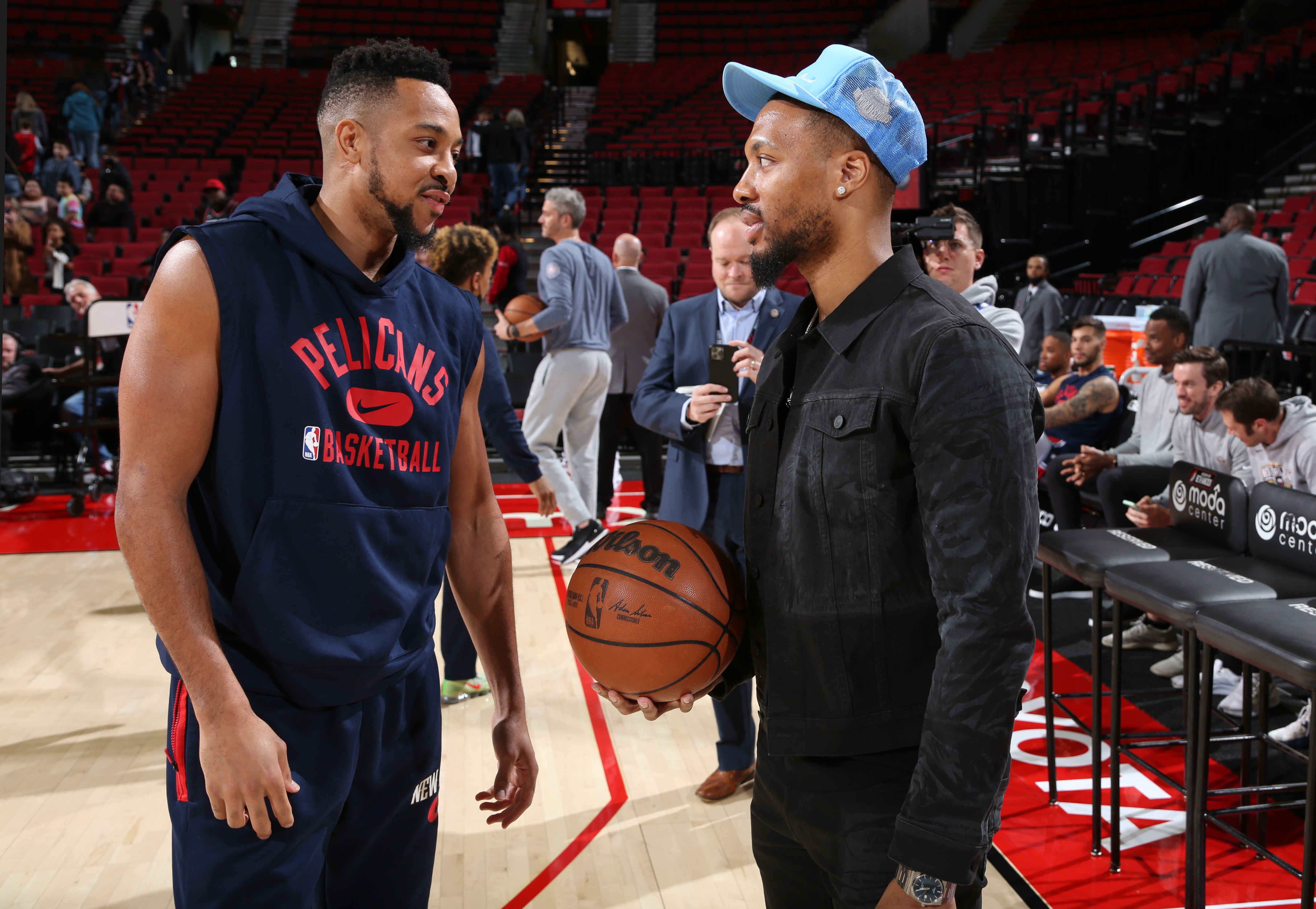 PORTLAND, OR - MARCH 30: Damian Lillard #0 of the Portland Trail Blazers and CJ McCollum #3 of the New Orleans Pelicans embrace before the game on March 30, 2022 at the Moda Center Arena in Portland, Oregon. NOTE TO USER: User expressly acknowledges and agrees that, by downloading and or using this photograph, user is consenting to the terms and conditions of the Getty Images License Agreement. Mandatory Copyright Notice: Copyright 2022 NBAE (Photo by Sam Forencich/NBAE via Getty Images)