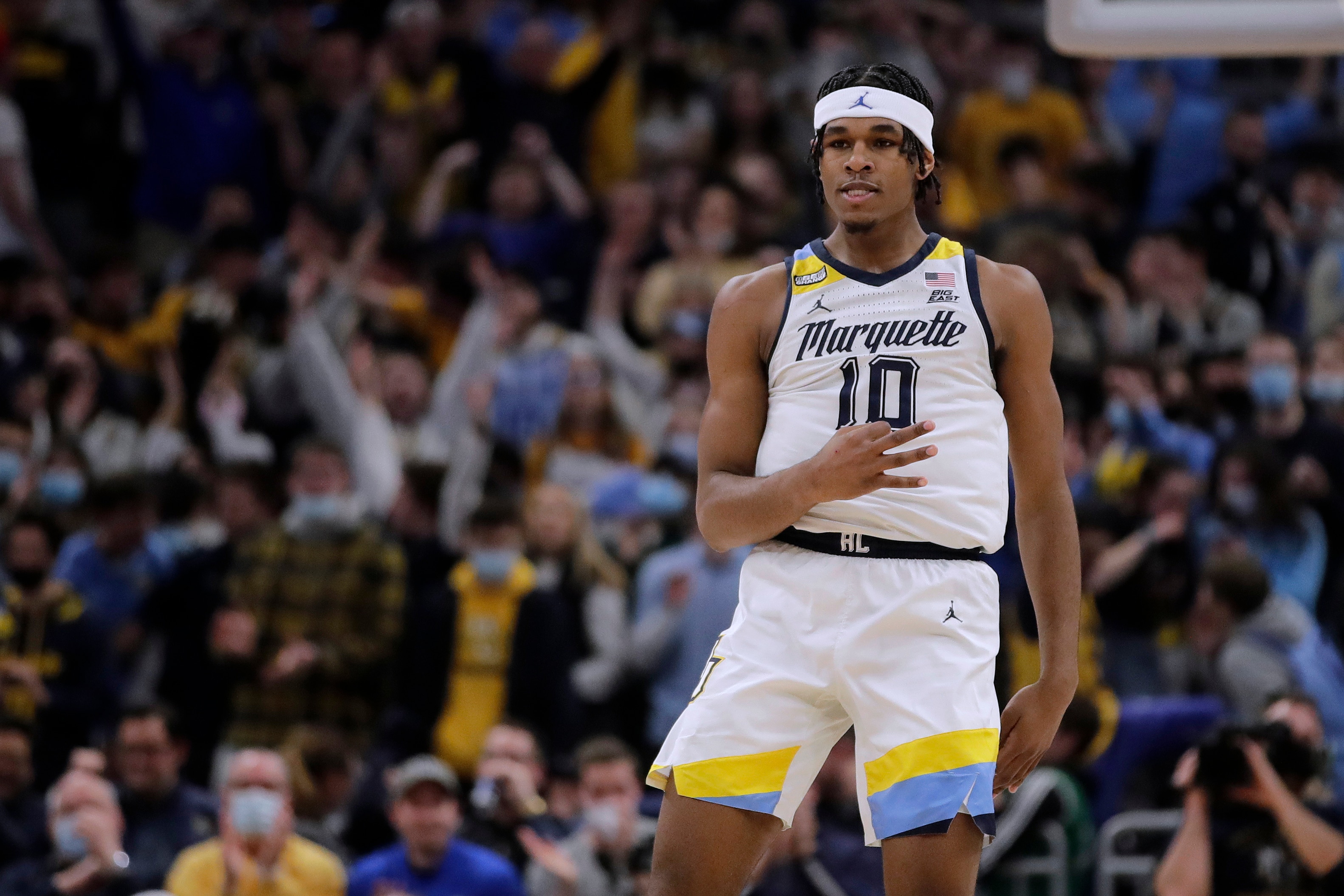 Marquette's Justin Lewis gestures after making a shot during the first half of the team's NCAA college basketball game against Villanova on Wednesday, Feb. 2, 2022, in Milwaukee. (AP Photo/Aaron Gash)