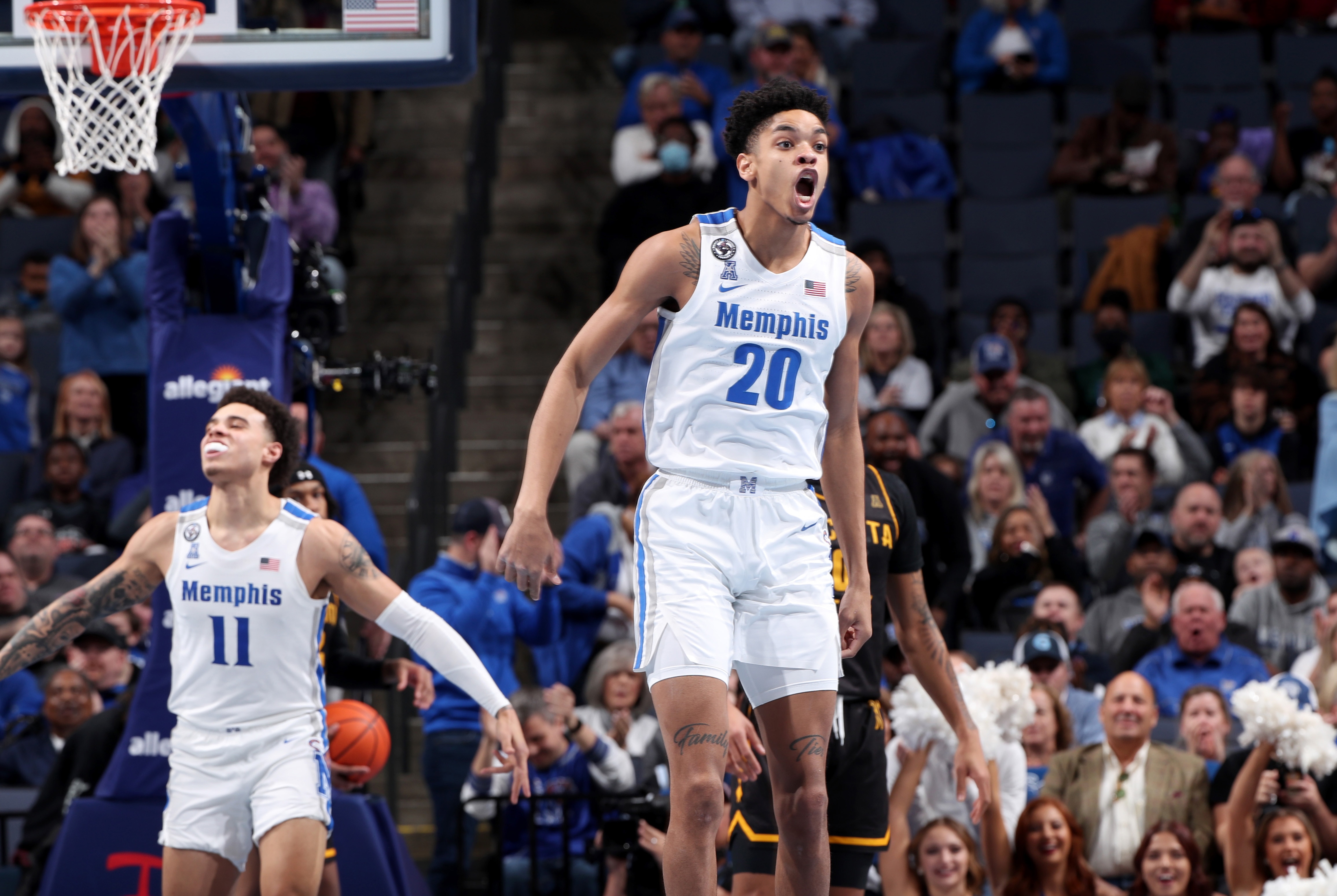 MEMPHIS, TN - FEBRUARY 27: Josh Minott #20 of the Memphis Tigers celebrates against the Wichita State Shockers on February 27, 2022 at FedExForum in Memphis, Tennessee. Memphis won 81-57. (Photo by Joe Murphy/Getty Images)