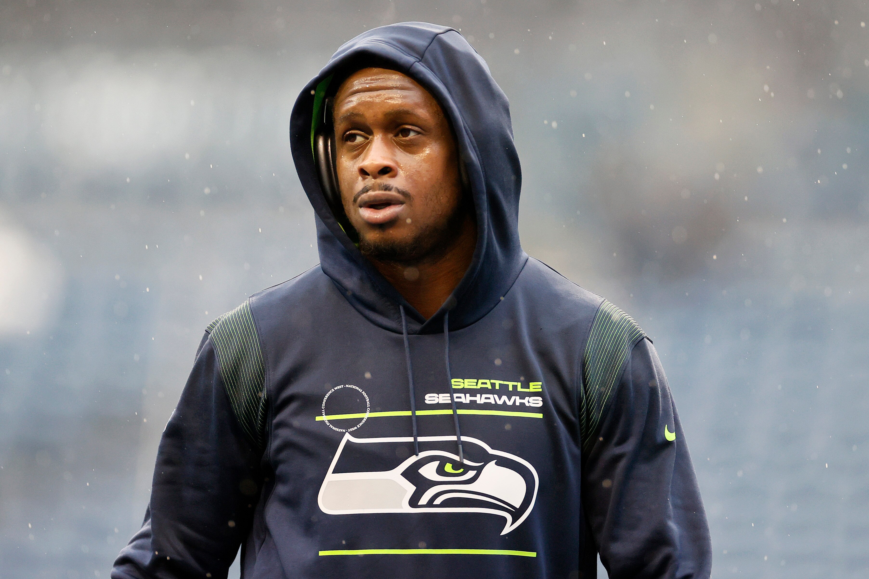 SEATTLE, WASHINGTON - JANUARY 02: Geno Smith #7 of the Seattle Seahawks looks on before the game against the Detroit Lions at Lumen Field on January 02, 2022 in Seattle, Washington. (Photo by Steph Chambers/Getty Images)