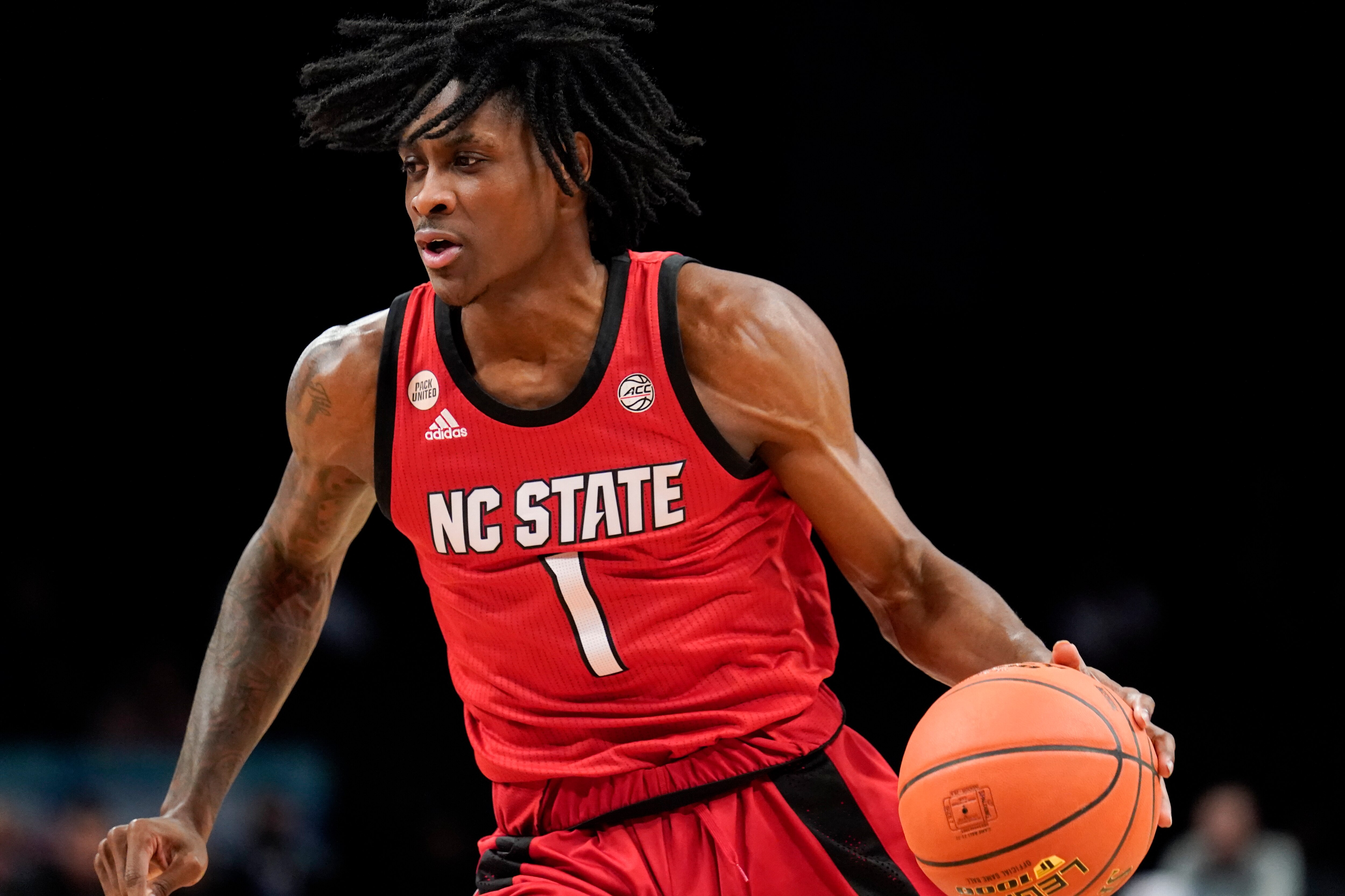 North Carolina State's Dereon Seabron (1) dribbles up the court during the first half of an NCAA college basketball game against Clemson during the Atlantic Coast Conference men's tournament, Tuesday, March 8, 2022, in New York. (AP Photo/John Minchillo)