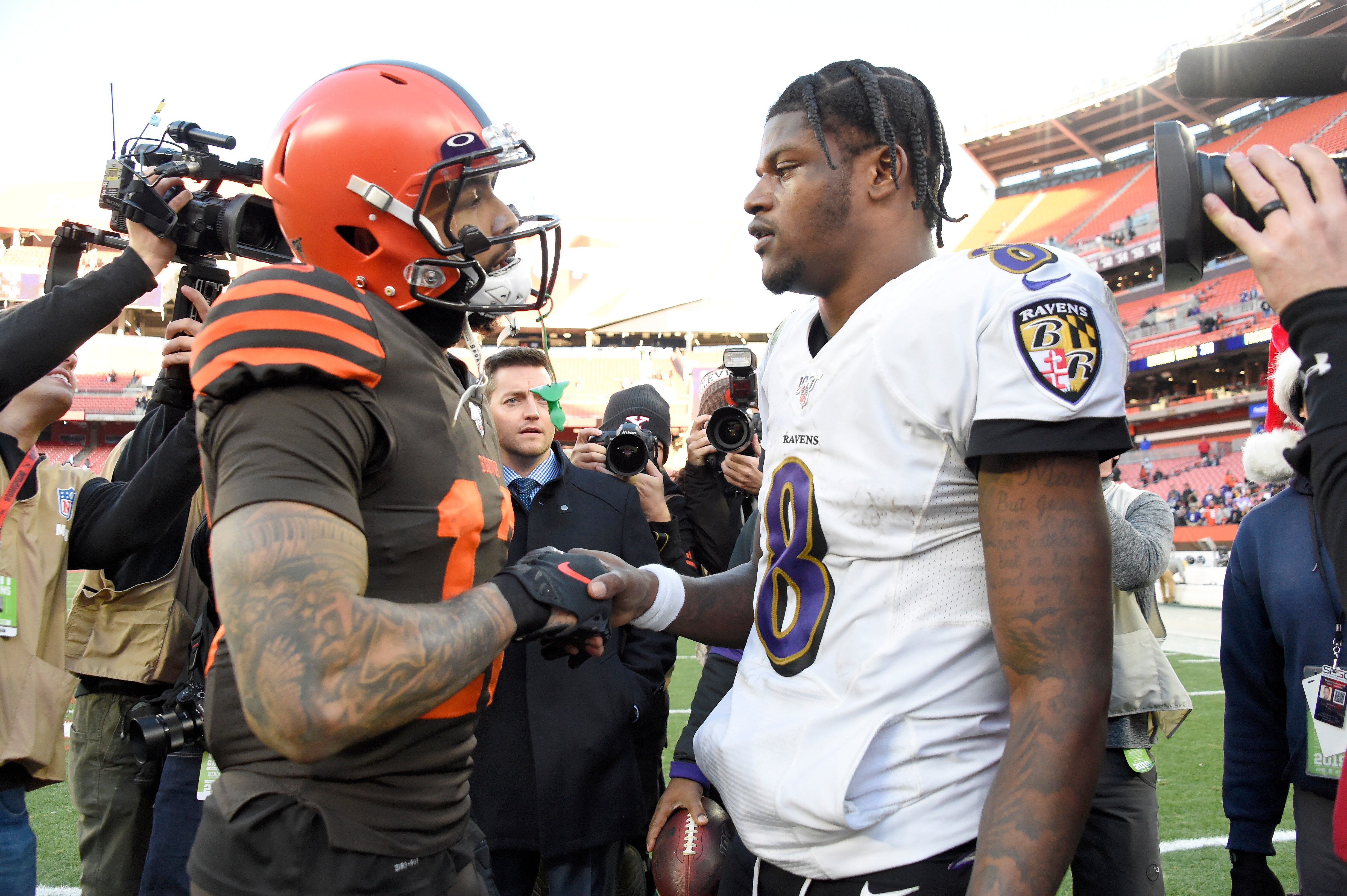 CLEVELAND, OHIO - DECEMBER 22: Wide receiver Odell Beckham #13 of the Cleveland Browns shakes hands with quarterback Lamar Jackson #8 of the Baltimore Ravens after the game at FirstEnergy Stadium on December 22, 2019 in Cleveland, Ohio. The Ravens defeated the Browns 31-15.  (Photo by Jason Miller/Getty Images)
