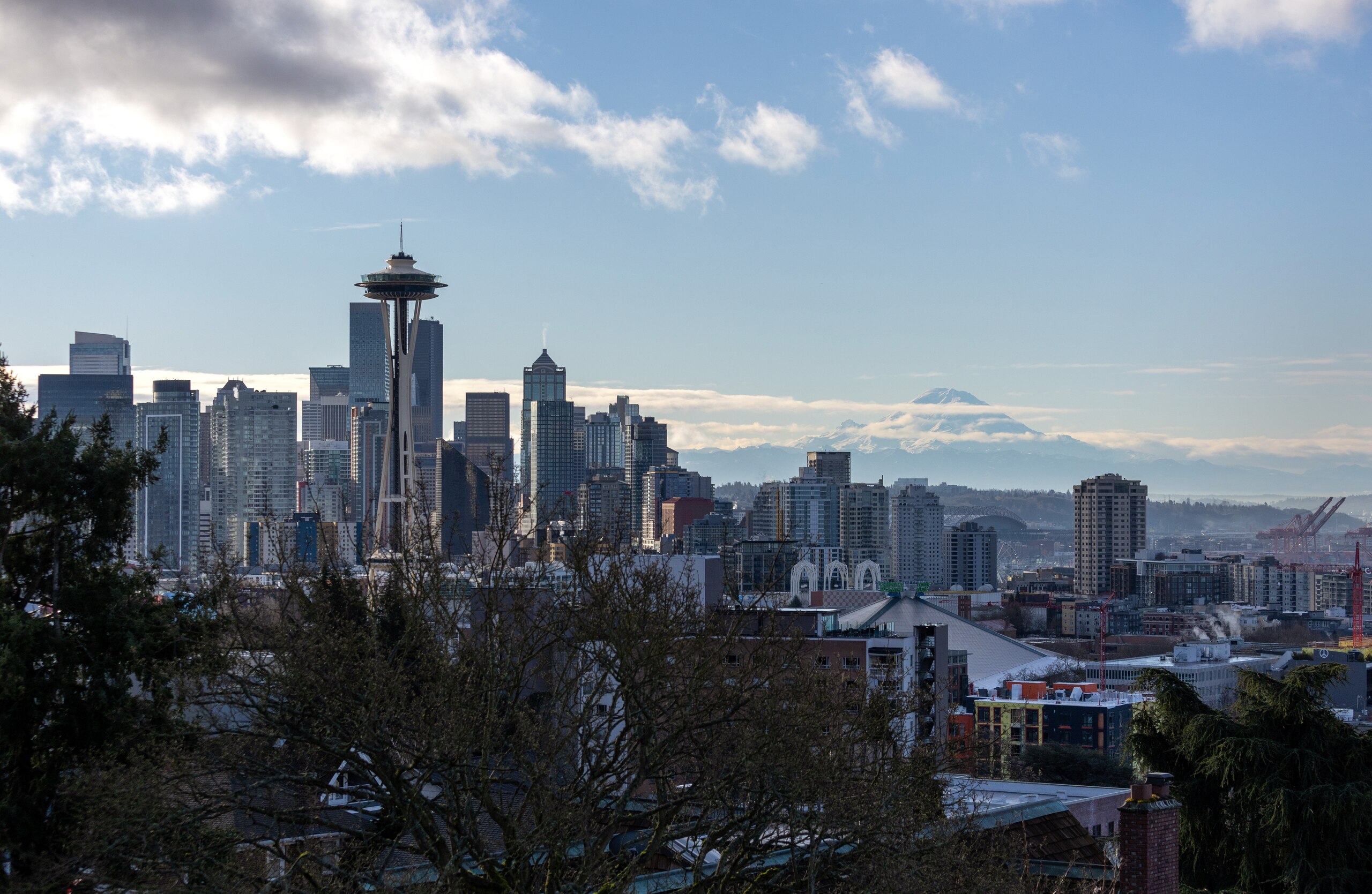 SEATTLE, WASHINGTON - MARCH 13: The Space Needle stands over the Seattle skyline as Mt. Rainier is seen in the background on March 13, 2022 in Seattle, Washington. The iconic observation tower was constructed in 1962 for the World's Fair. Years later, the Space Needle remains a top tourist draw despite the city's recent struggles with an uptick in homelessness and violent crime.  (Photo by John Moore/Getty Images)