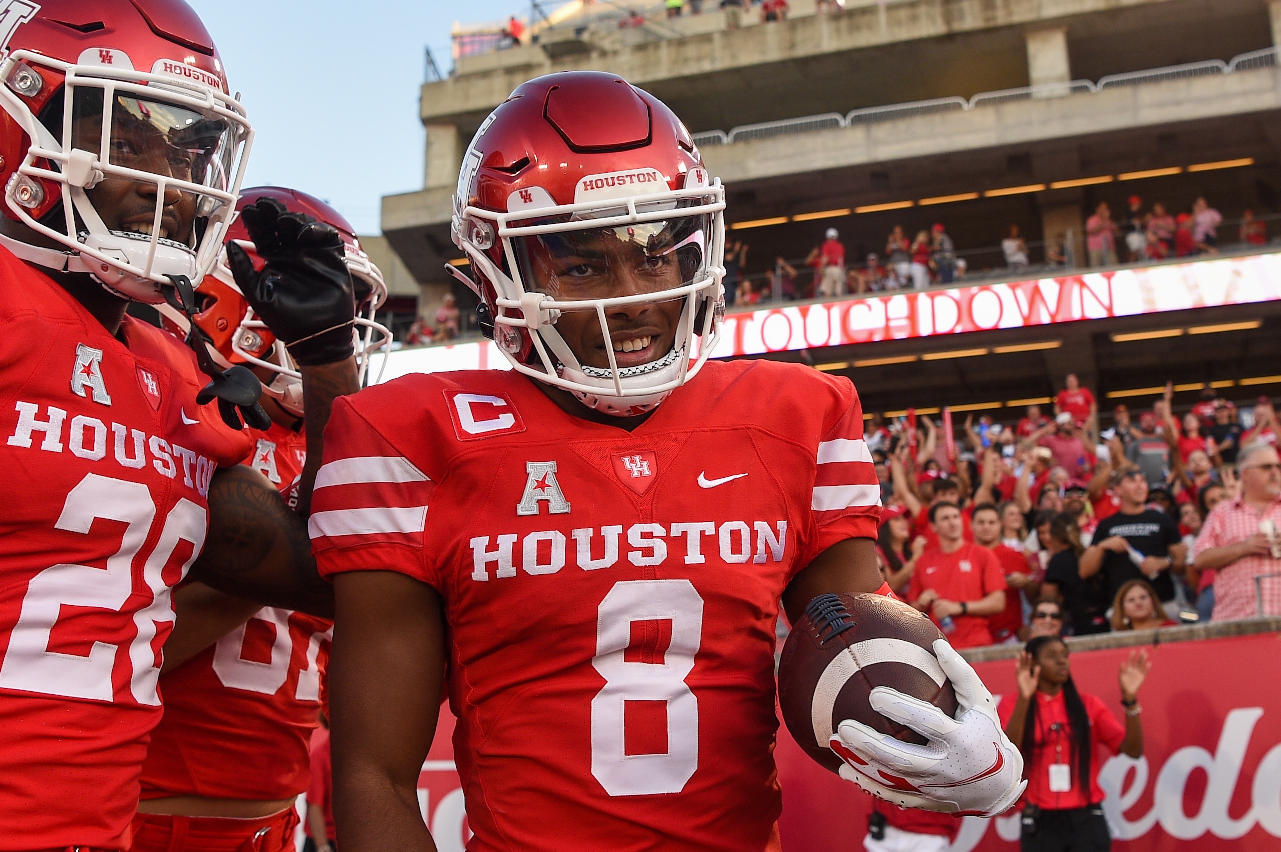 HOUSTON, CA - SEPTEMBER 25: Houston Cougars cornerback Marcus Jones (8) celebrates a punt return for a touchdown during the football game between the Navy Midshipmen and Houston Cougars at TDECU Stadium on September 25, 2021 in Houston, Texas. (Photo by Ken Murray/Icon Sportswire via Getty Images)