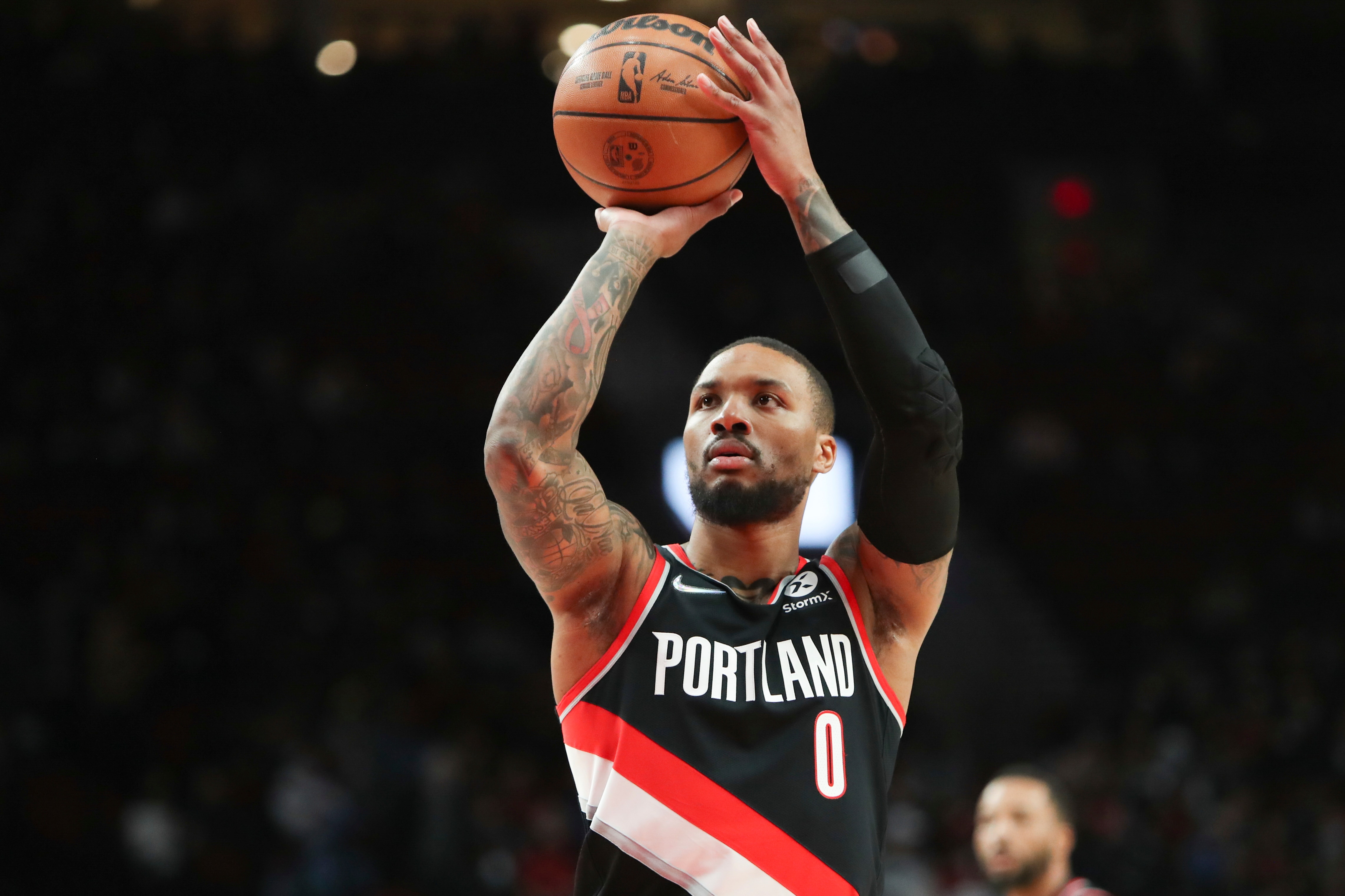 Portland Trail Blazers guard Damian Lillard takes a free throw during the first half of an NBA basketball game against the Dallas Mavericks in Portland, Ore., Monday, Dec. 27, 2021. Dallas Mavericks won 132-117. (AP Photo/Amanda Loman)