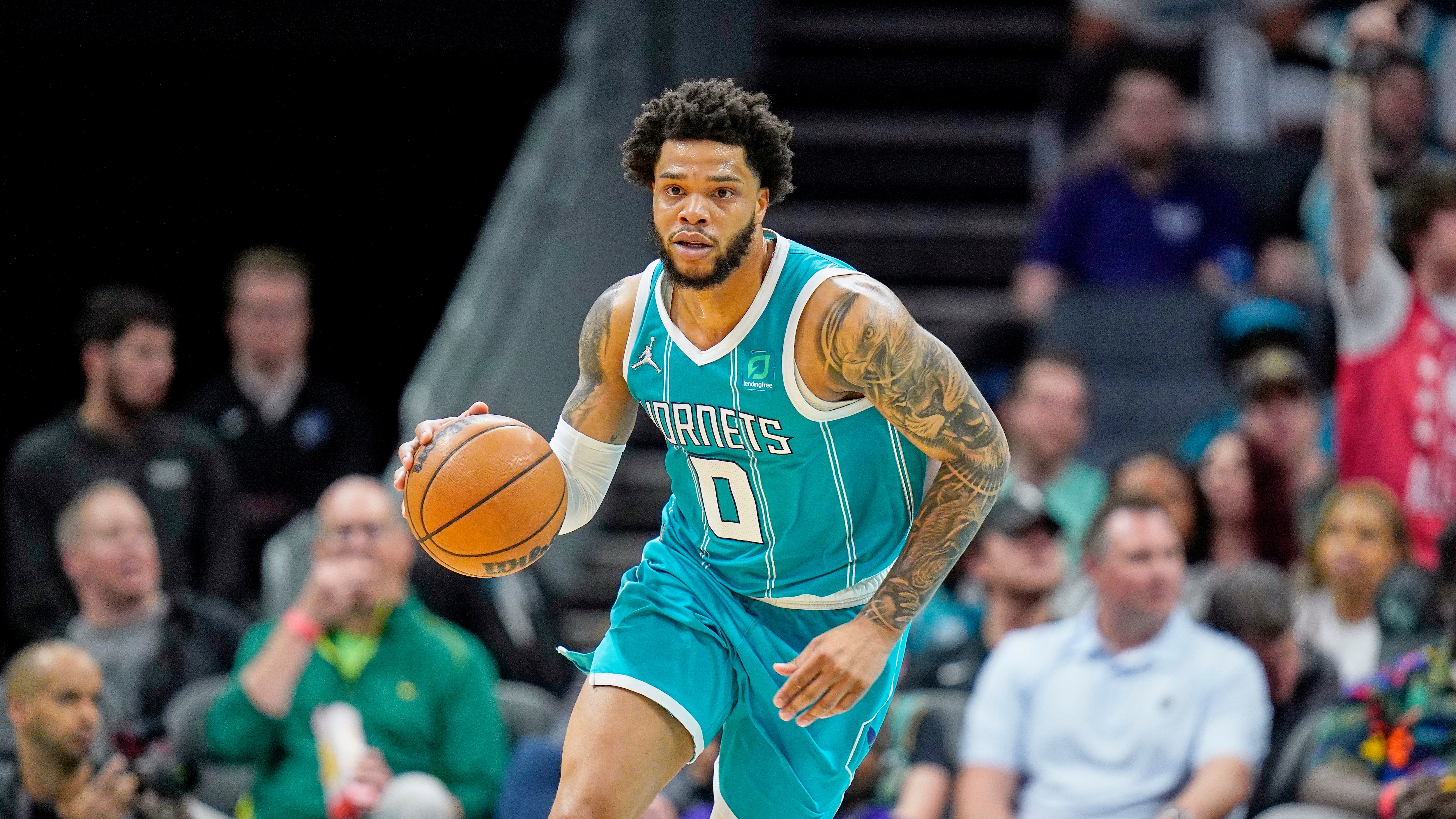 Charlotte Hornets forward Miles Bridges (0) brings the ball up court during an NBA basketball game against the Orlando Magic on Thursday, April 7, 2022, in Charlotte, N.C. (AP Photo/Rusty Jones)