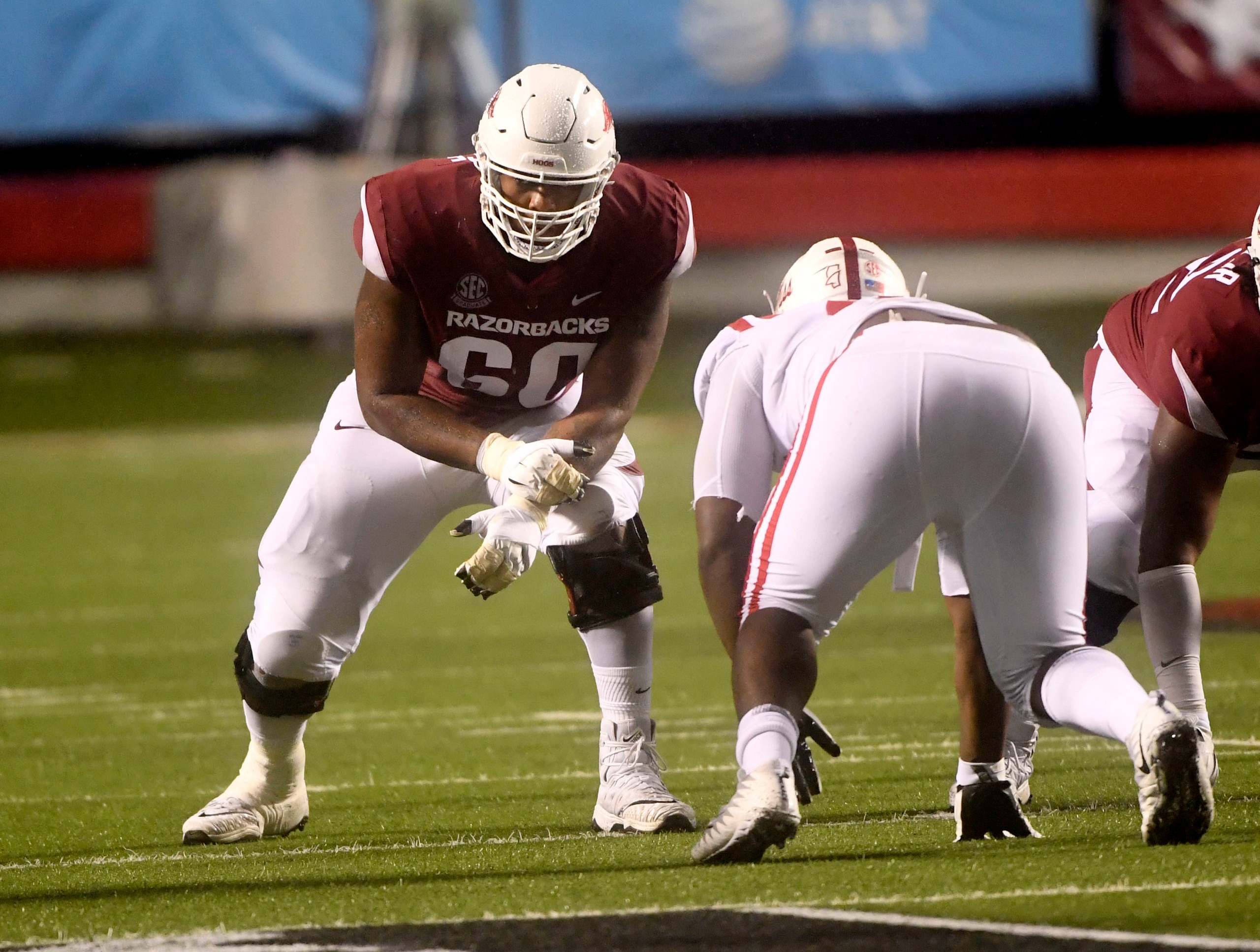 Arkansas offensive lineman Brian Wallace gets ready to run a play against Mississippi in the first half of an NCAA college football game Saturday, Oct. 13, 2018, in Little Rock, Ark. (AP Photo/Michael Woods)