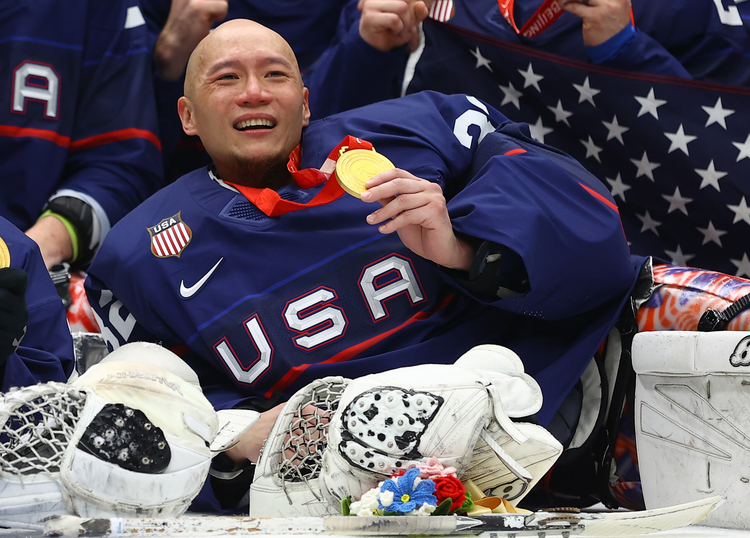 BEIJING, CHINA - MARCH 13: Gold medal winner Jen Lee #32 of Team United States celebrates during the Para Ice Hockey medal ceremony after the Gold Medal game on day nine of the Beijing 2022 Winter Paralympics at the National Indoor Stadium on March 13, 2022 in Beijing, China. (Photo by Michael Steele/Getty Images)