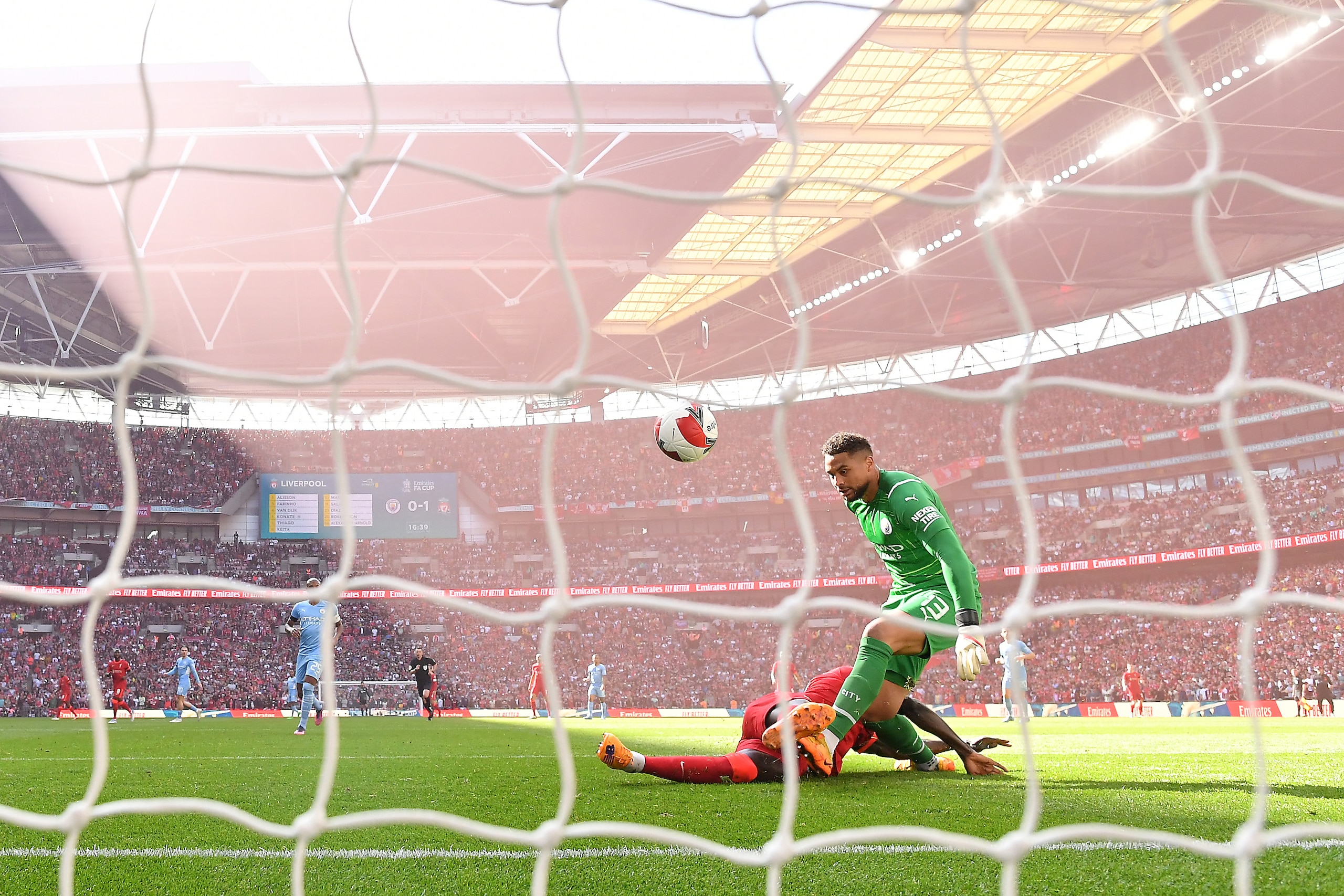 LONDON, ENGLAND - APRIL 16: Sadio Mane of Liverpool scores their side's second goal past Zack Steffen of Manchester City during The Emirates FA Cup Semi-Final match between Manchester City and Liverpool at Wembley Stadium on April 16, 2022 in London, England. (Photo by Justin Setterfield - The FA/The FA via Getty Images)