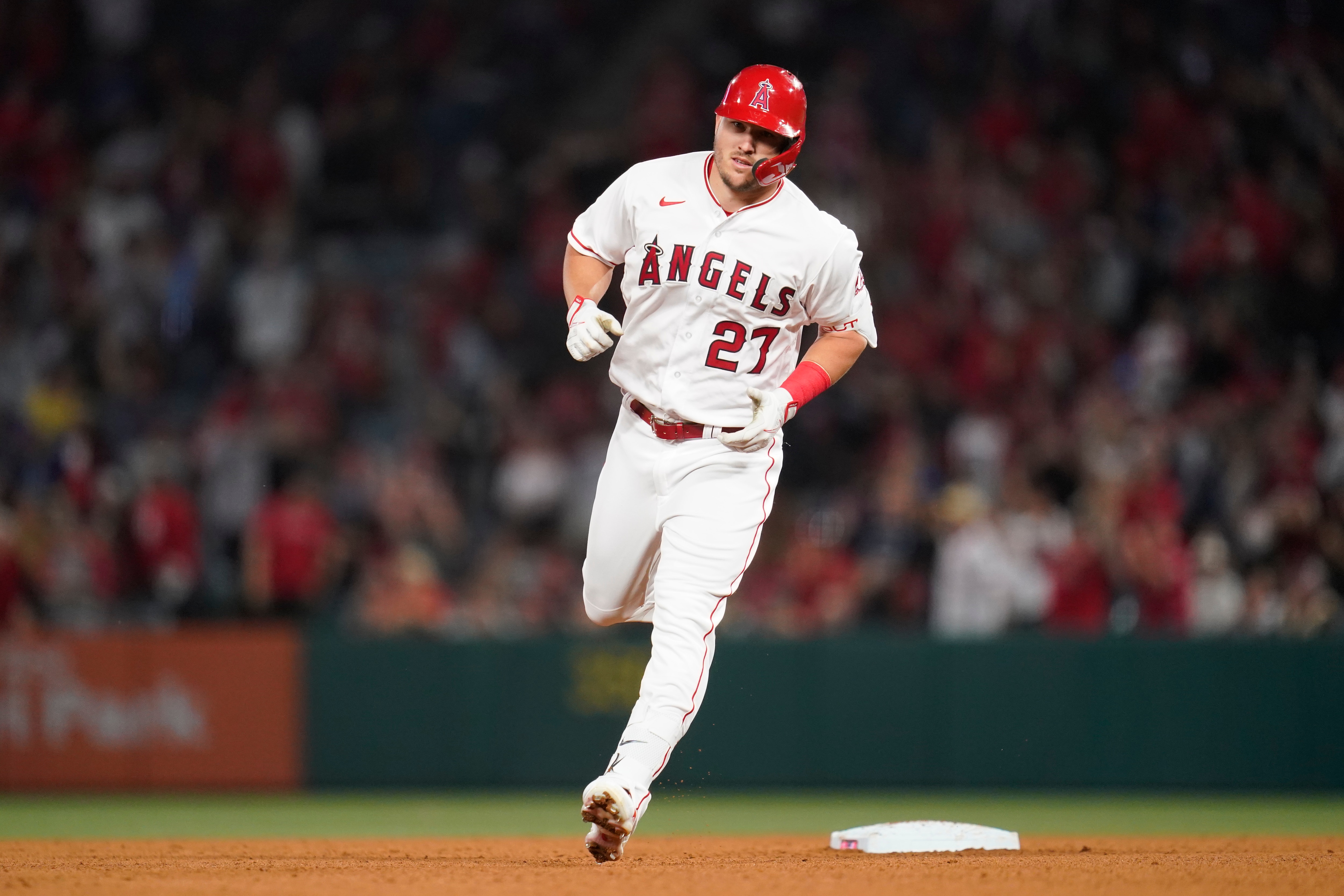 Los Angeles Angels center fielder Mike Trout (27) runs the bases after hitting a homerun during the seventh inning of a baseball game against the Houston Astros in Anaheim, Calif., Saturday, April 9, 2022. (AP Photo/Ashley Landis)