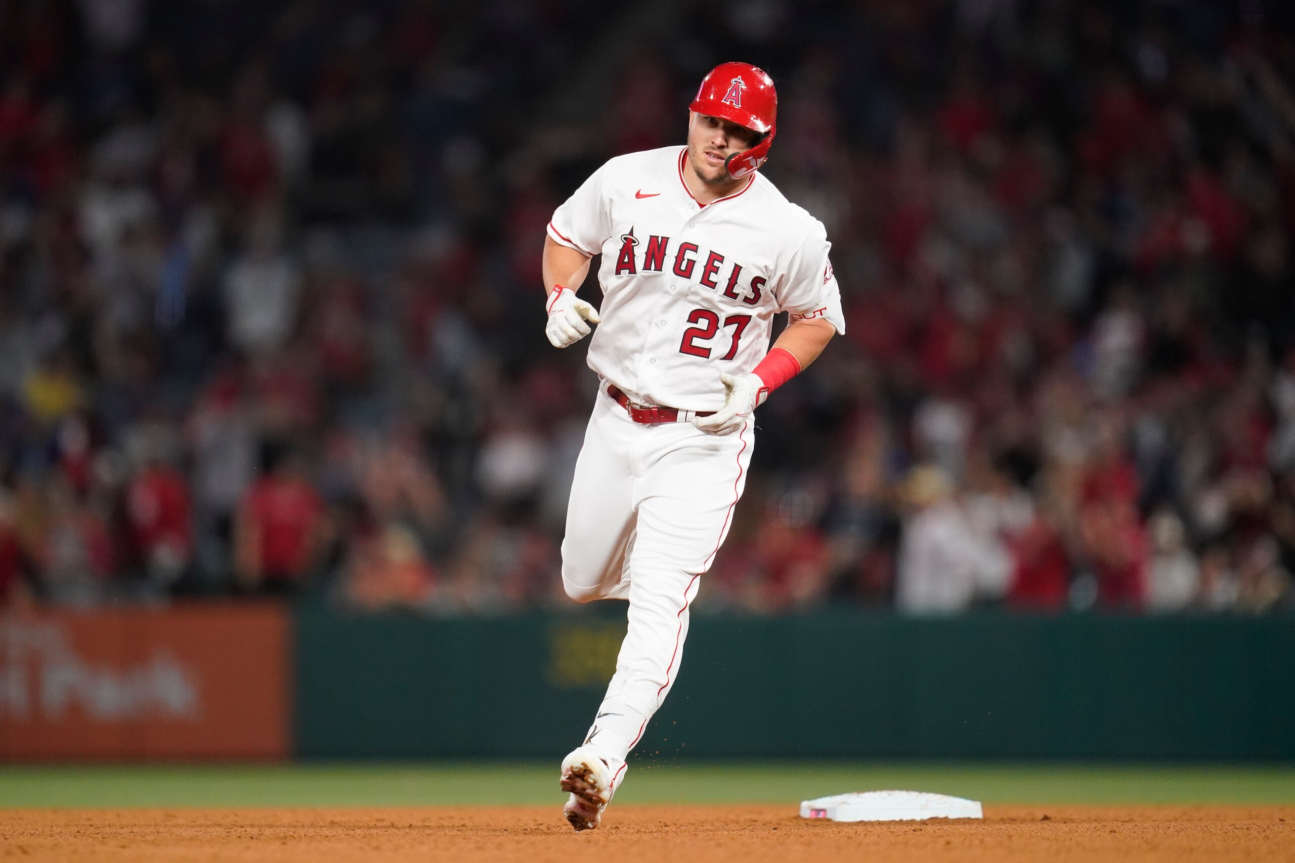 Los Angeles Angels center fielder Mike Trout (27) runs the bases after hitting a homerun during the seventh inning of a baseball game against the Houston Astros in Anaheim, Calif., Saturday, April 9, 2022. (AP Photo/Ashley Landis)