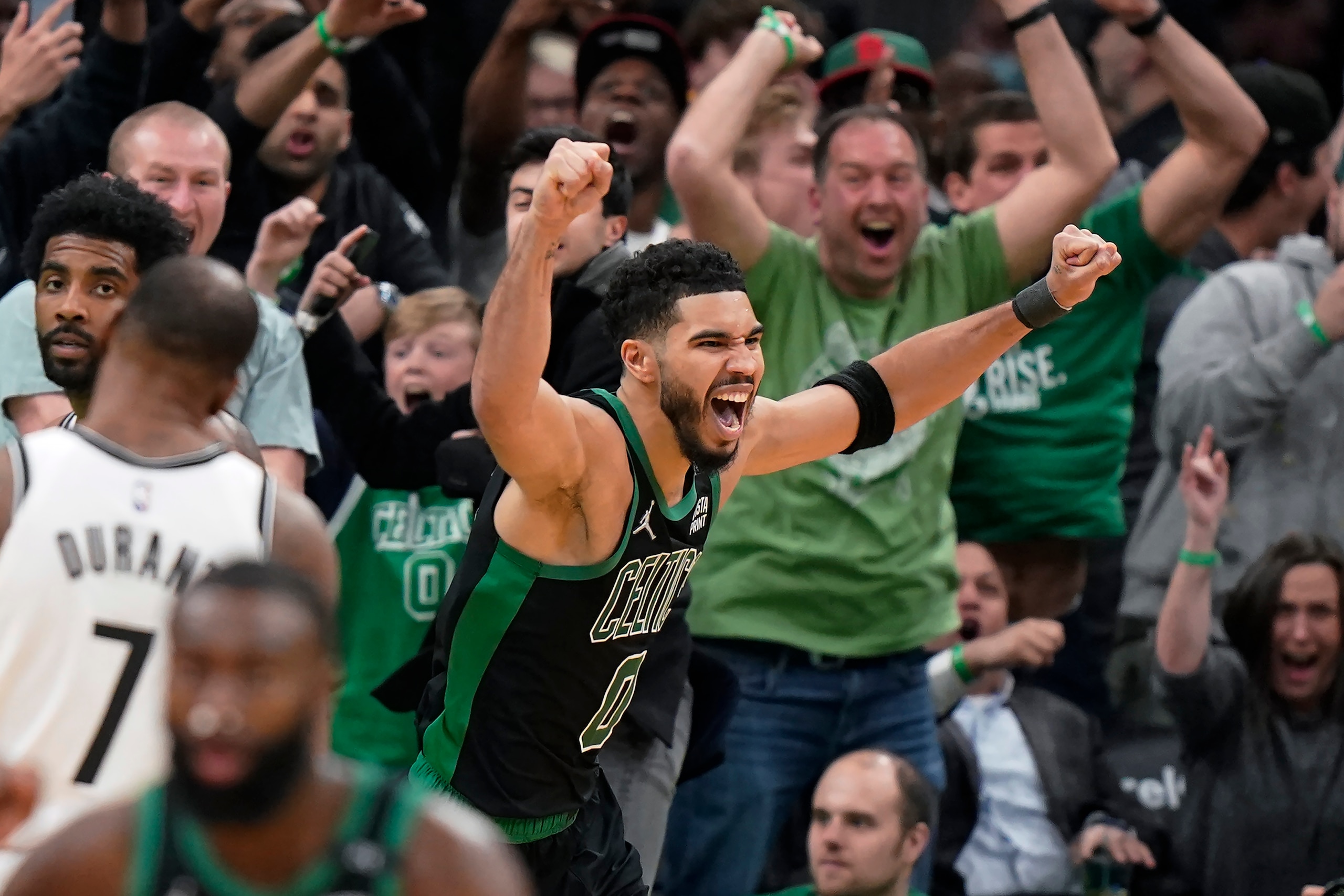Boston Celtics forward Jayson Tatum (0) celebrates after making a layup at the buzzer to score and win Game 1 of an NBA basketball first-round Eastern Conference playoff series against the Brooklyn Nets, Sunday, April 17, 2022, in Boston. The Celtics won 115-114. (AP Photo/Steven Senne)