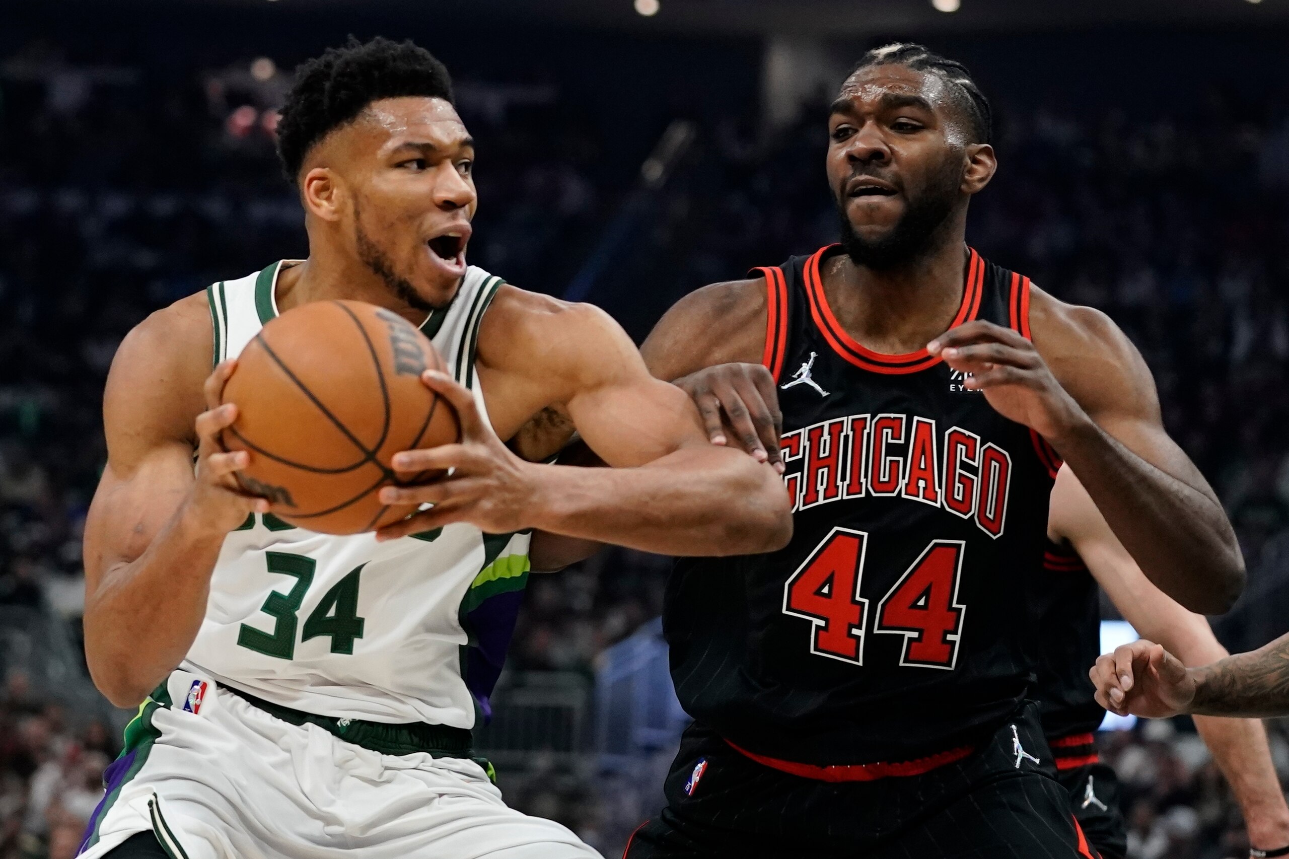 Milwaukee Bucks' Giannis Antetokounmpo drives past Chicago Bulls' Patrick Williams during the first half of Game 1 of their first round NBA playoff basketball game Sunday, April 17, 2022, in Milwaukee. (AP Photo/Morry Gash)