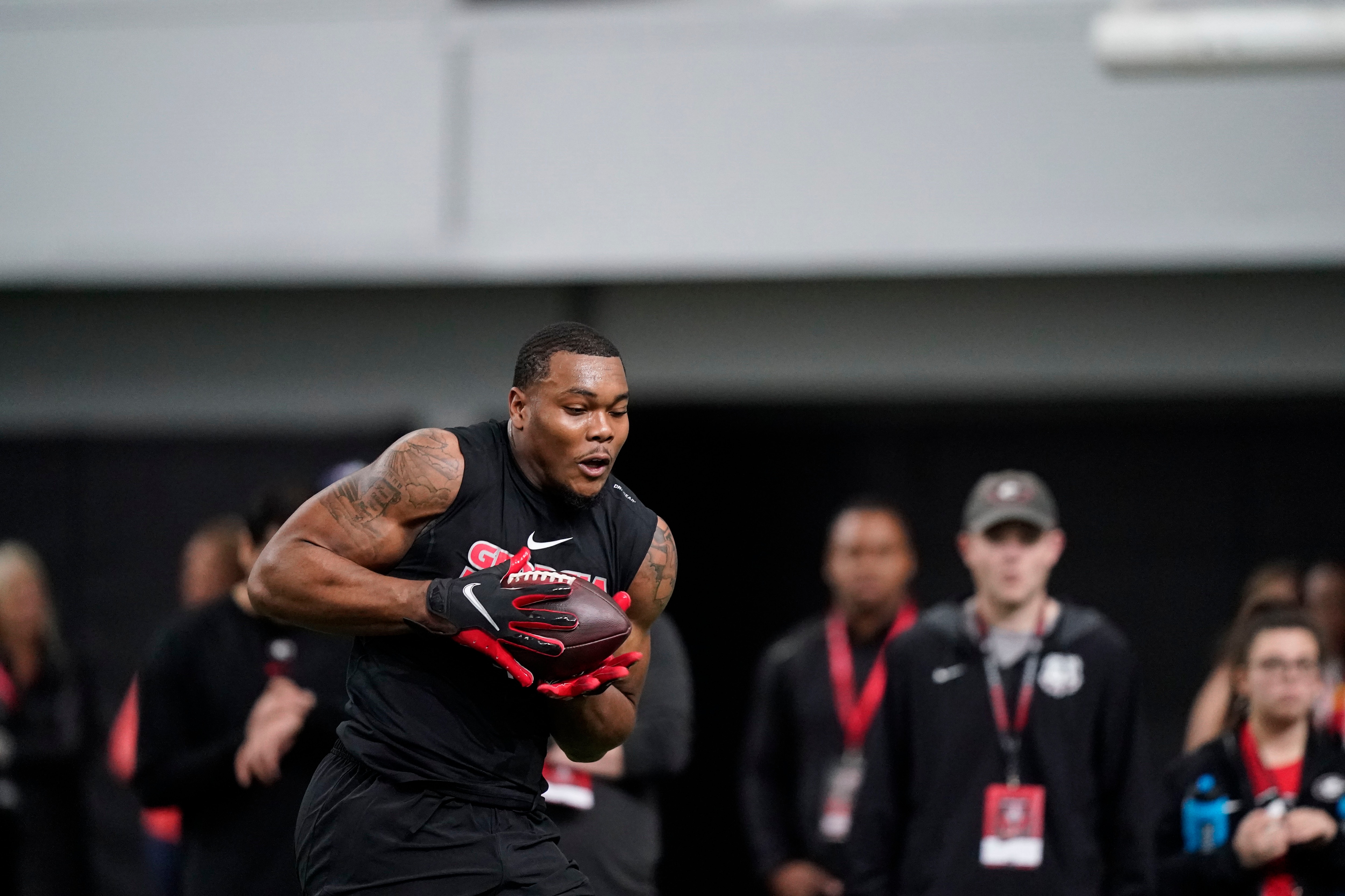 Travon Walker runs football drills during Georgia's Pro Day on Wednesday, March 16, 2022, in Athens, Ga. (AP Photo/Brynn Anderson)