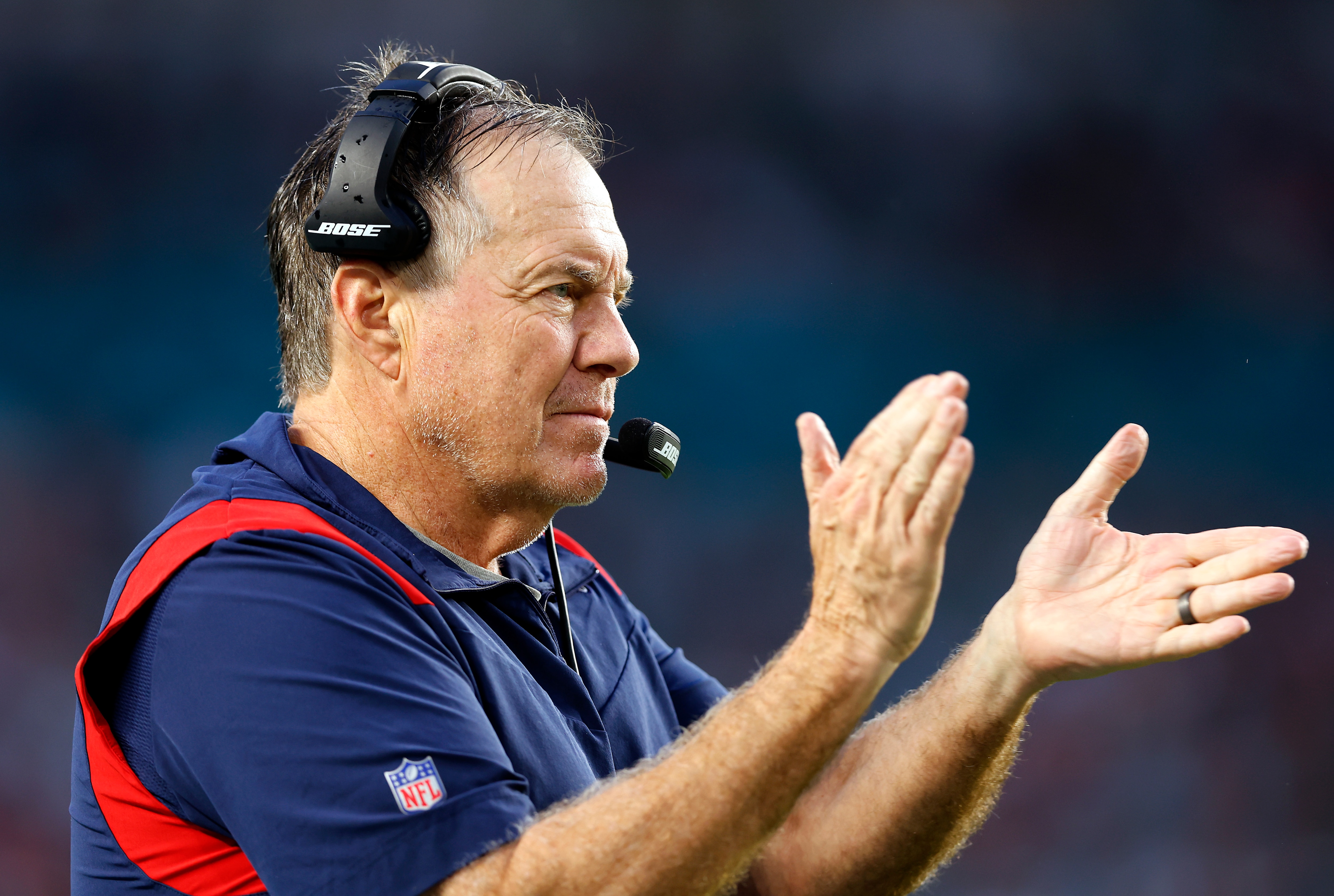 MIAMI GARDENS, FLORIDA - JANUARY 09: Head coach Bill Belichick of the New England Patriots reacts on the sidelines in the second quarter of the game against the Miami Dolphins at Hard Rock Stadium on January 09, 2022 in Miami Gardens, Florida. (Photo by Michael Reaves/Getty Images)