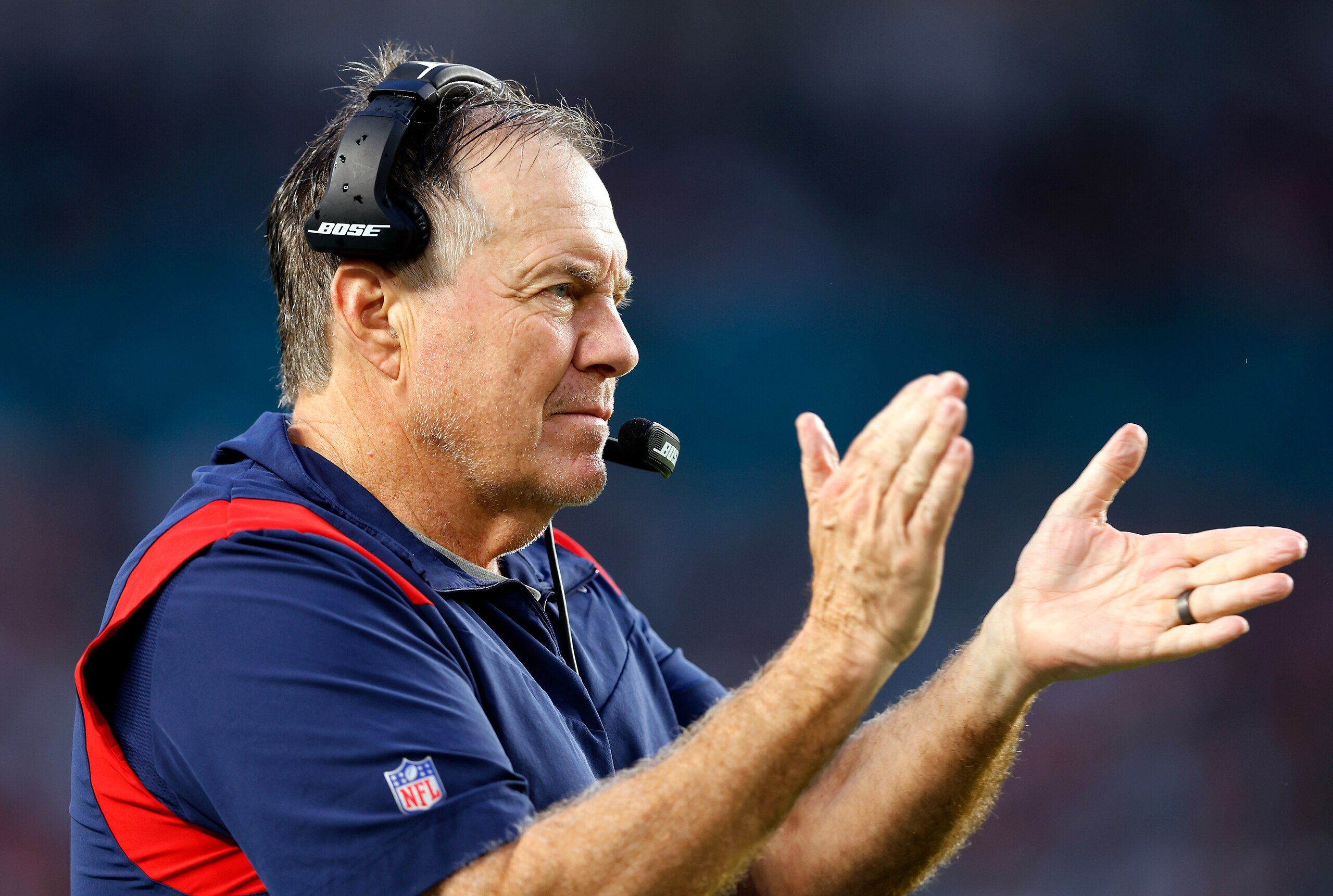 MIAMI GARDENS, FLORIDA - JANUARY 09: Head coach Bill Belichick of the New England Patriots reacts on the sidelines in the second quarter of the game against the Miami Dolphins at Hard Rock Stadium on January 09, 2022 in Miami Gardens, Florida. (Photo by Michael Reaves/Getty Images)