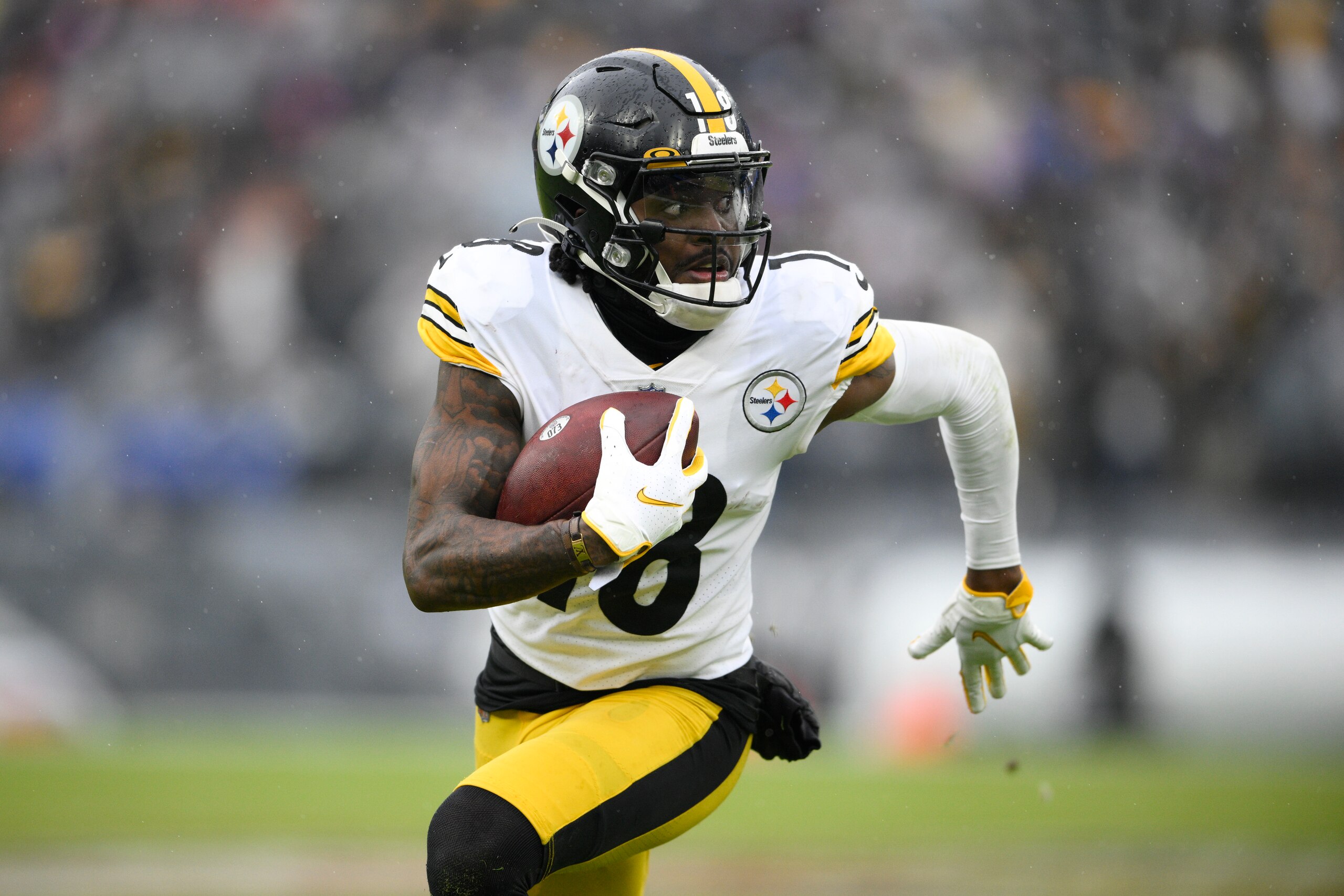 Pittsburgh Steelers wide receiver Diontae Johnson runs with the ball after making a catch against the Baltimore Ravens during the second half of an NFL football game, Sunday, Jan. 9, 2022, in Baltimore. (AP Photo/Nick Wass)