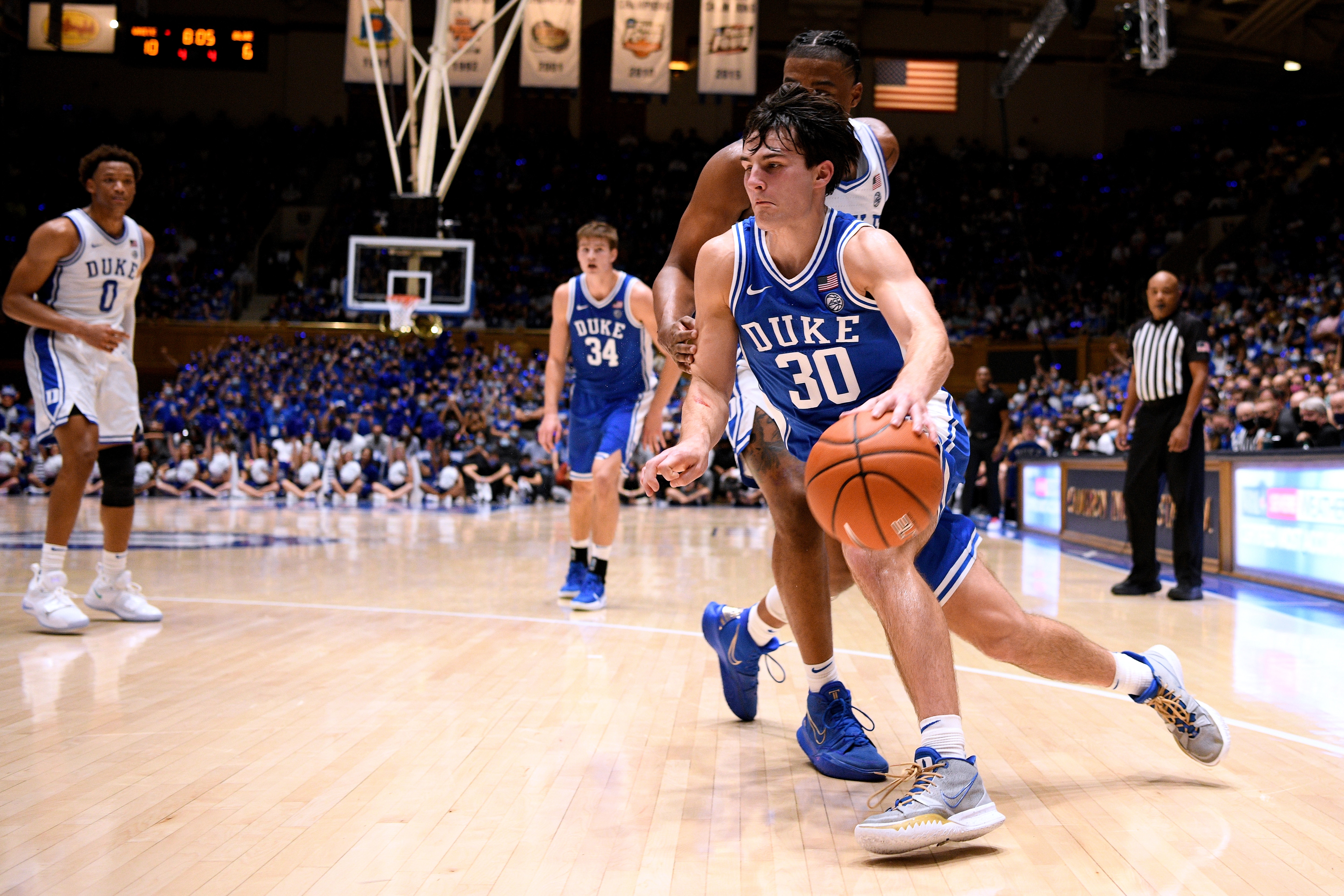 DURHAM, NC - OCTOBER 15: Michael Savarino #30 of the Duke Blue Devils drives past Trevor Keels #1 during Countdown To Craziness at Cameron Indoor Stadium on October 15, 2021 in Durham, North Carolina. (Photo by Lance King/Getty Images)