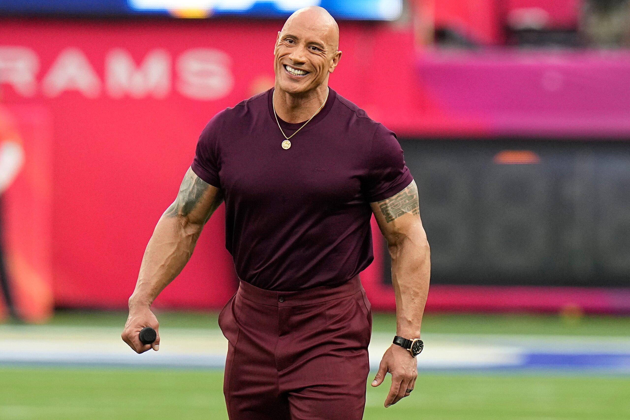 Dwayne "The Rock" Johnson smiles before the NFL Super Bowl 56 football game between the Los Angeles Rams and the Cincinnati Bengals, Sunday, Feb. 13, 2022, in Inglewood, Calif. (AP Photo/Chris O'Meara)