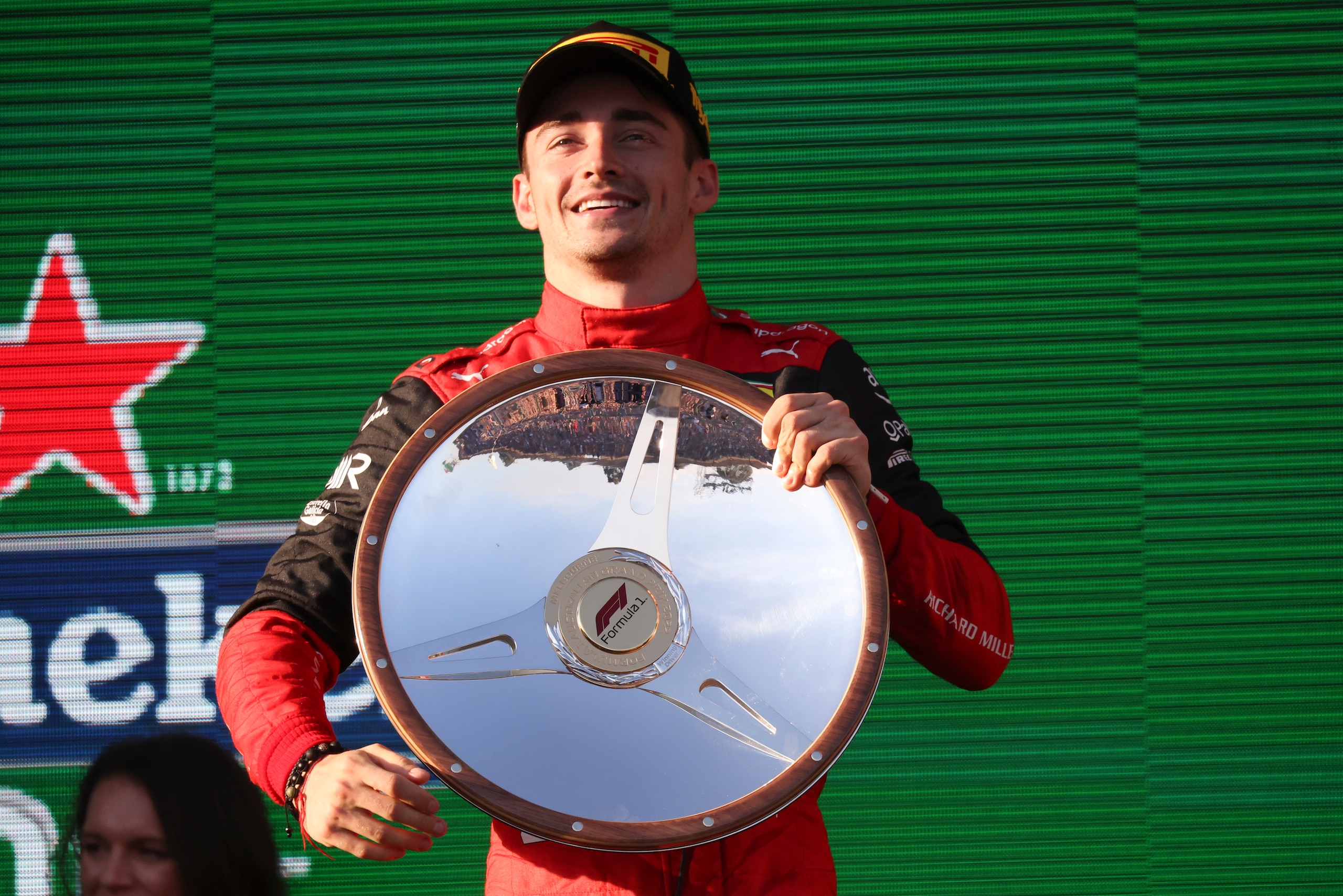 Ferrari driver Charles Leclerc of Monaco holds his trophy after winning the Australian Formula One Grand Prix in Melbourne, Australia, Sunday, April 10, 2022. (AP Photo/Asanka Brendon Ratnayake)