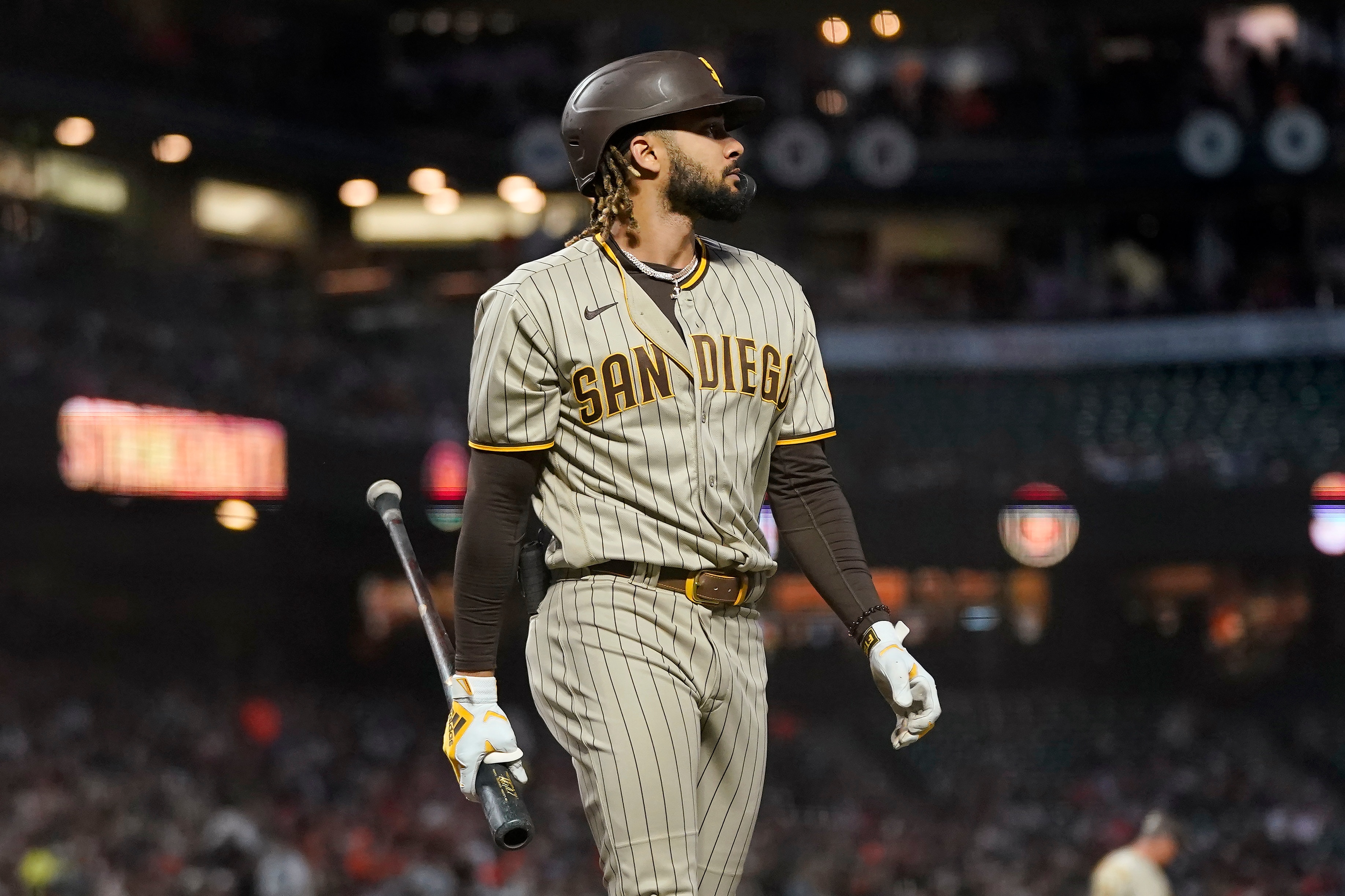 San Diego Padres' Fernando Tatis Jr. walks to the dugout after striking out against the San Francisco Giants during the first inning of a baseball game in San Francisco, Friday, Oct. 1, 2021. (AP Photo/Jeff Chiu)