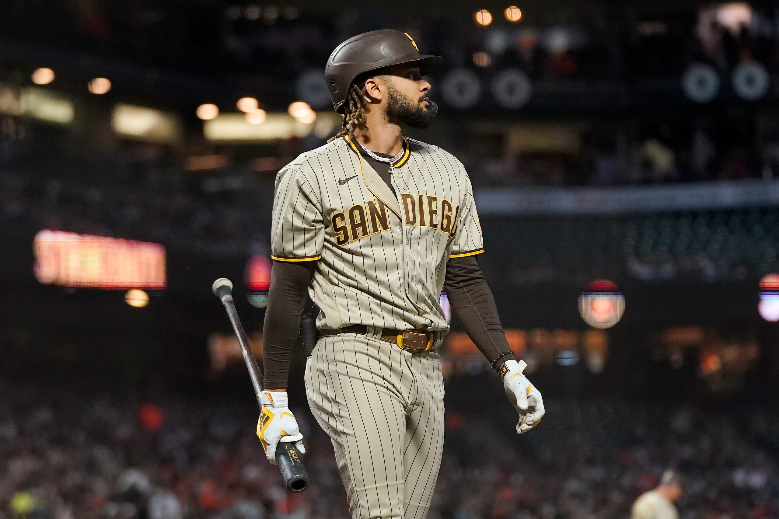 San Diego Padres' Fernando Tatis Jr. walks to the dugout after striking out against the San Francisco Giants during the first inning of a baseball game in San Francisco, Friday, Oct. 1, 2021. (AP Photo/Jeff Chiu)