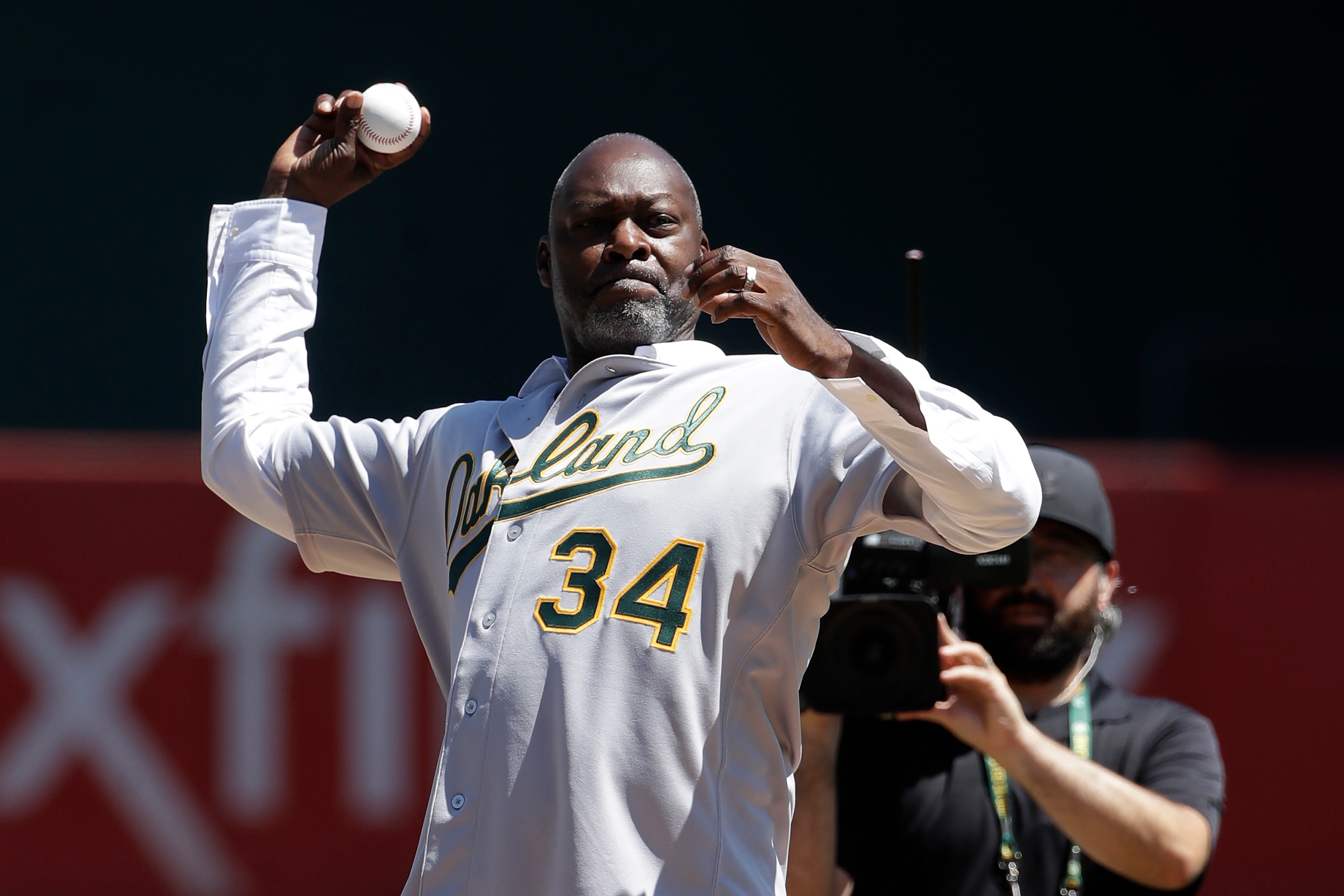 Former Oakland Athletics player Dave Stewart throws out the ceremonial first pitch before a baseball game between the Athletics and the San Francisco Giants in Oakland, Calif., Sunday, Aug. 25, 2019. (AP Photo/Jeff Chiu) Former Oakland Athletics player Dave Stewart throws out the ceremonial first pitch before a baseball game between the Athletics and the San Francisco Giants in Oakland, Calif., Sunday, Aug. 25, 2019. (AP Photo/Jeff Chiu)