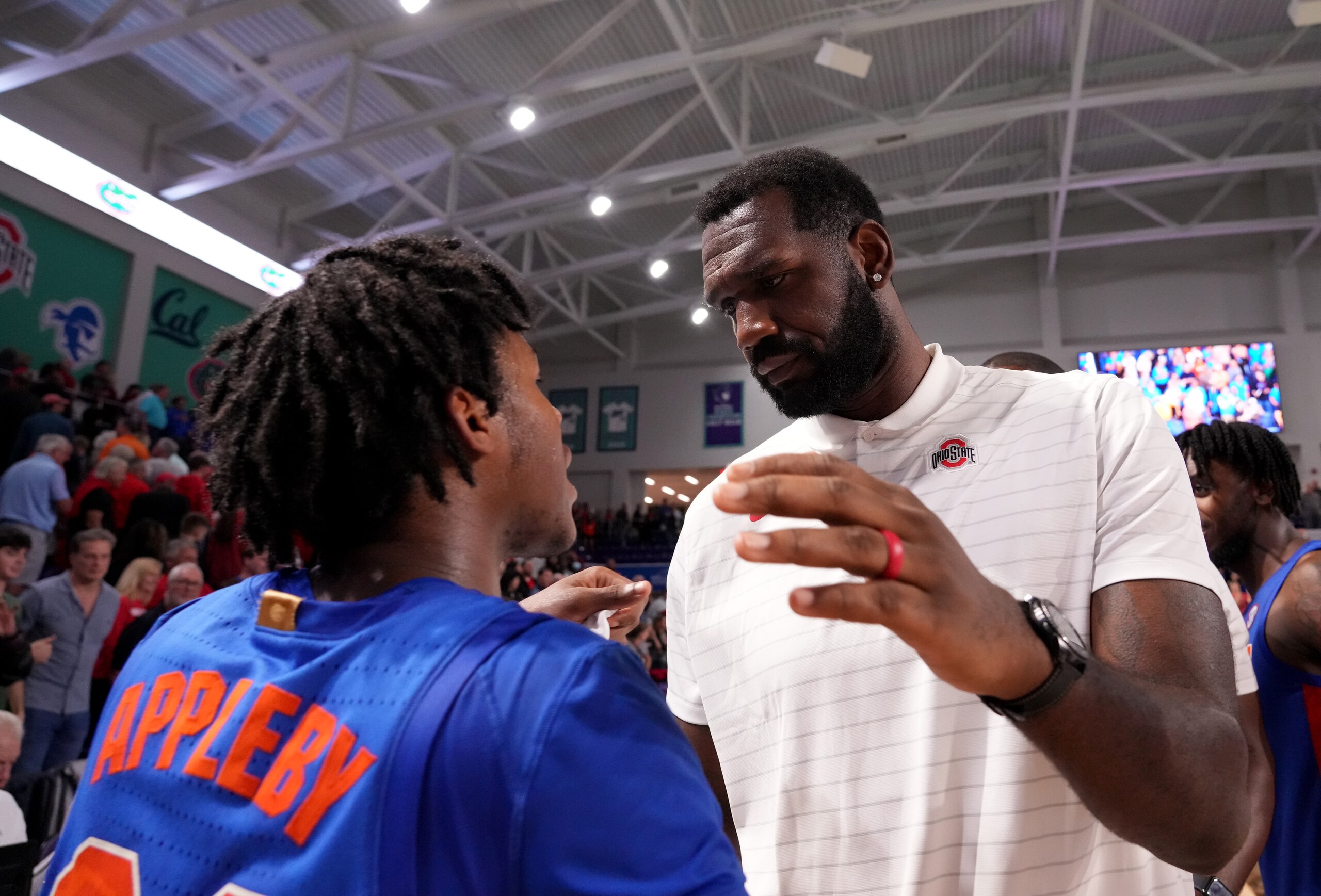 FORT MYERS, FLORIDA - NOVEMBER 24:  Ohio State Graduate Assistant coach Greg Oden shakes hands Tyree Appleby #22 of the Florida Gators after the Championship Game in the Beach Division of The Fort Myers Tip-Off at Suncoast Credit Union Arena on November 24, 2021 in Fort Myers, Florida. (Photo by Mark Brown/Getty Images)
