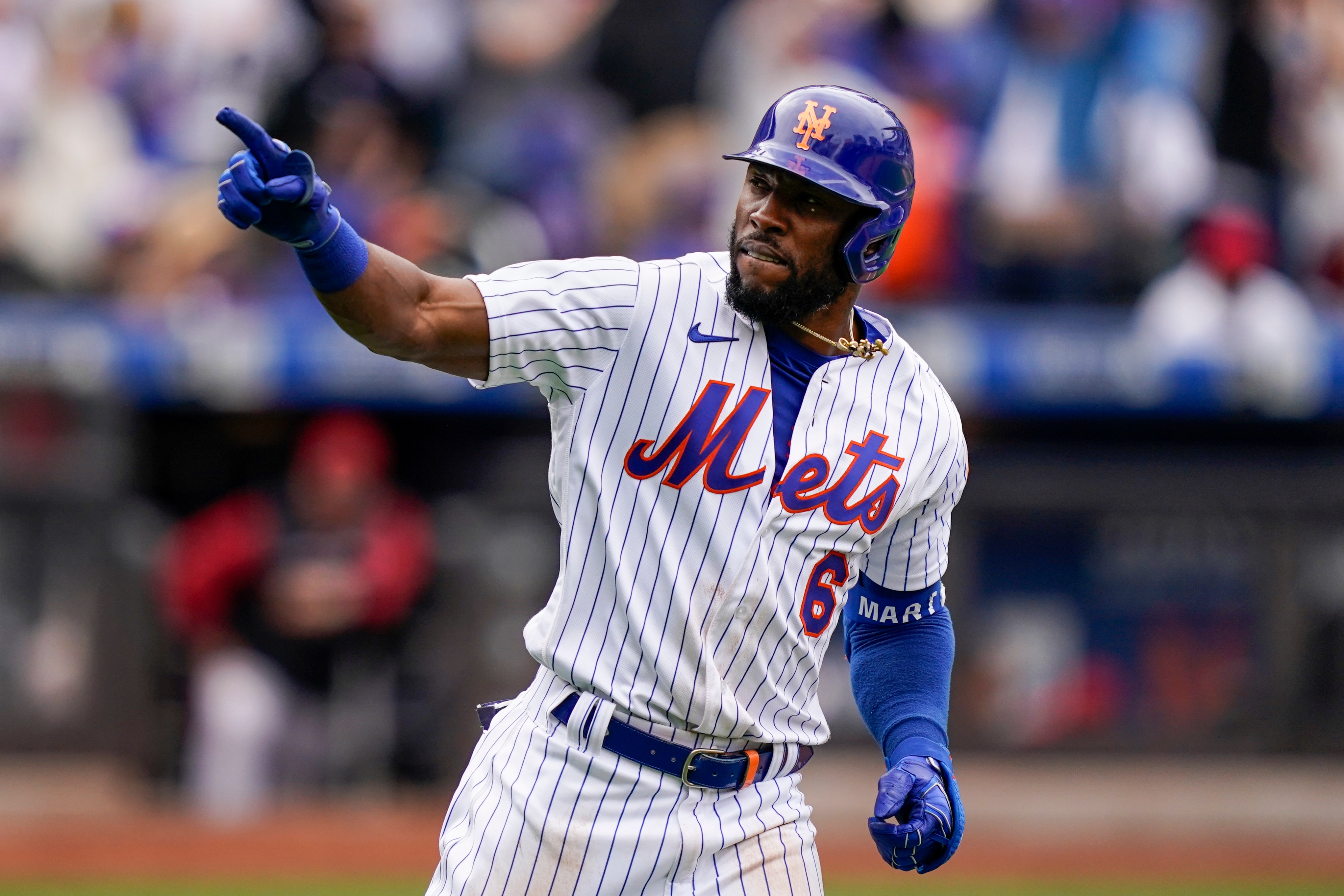 New York Mets' Starling Marte celebrates as he runs the bases after hitting a two-run home run off Arizona Diamondbacks relief pitcher Ian Kennedy in the eighth inning of a baseball game, Saturday, April 16, 2022, in New York. (AP Photo/John Minchillo)