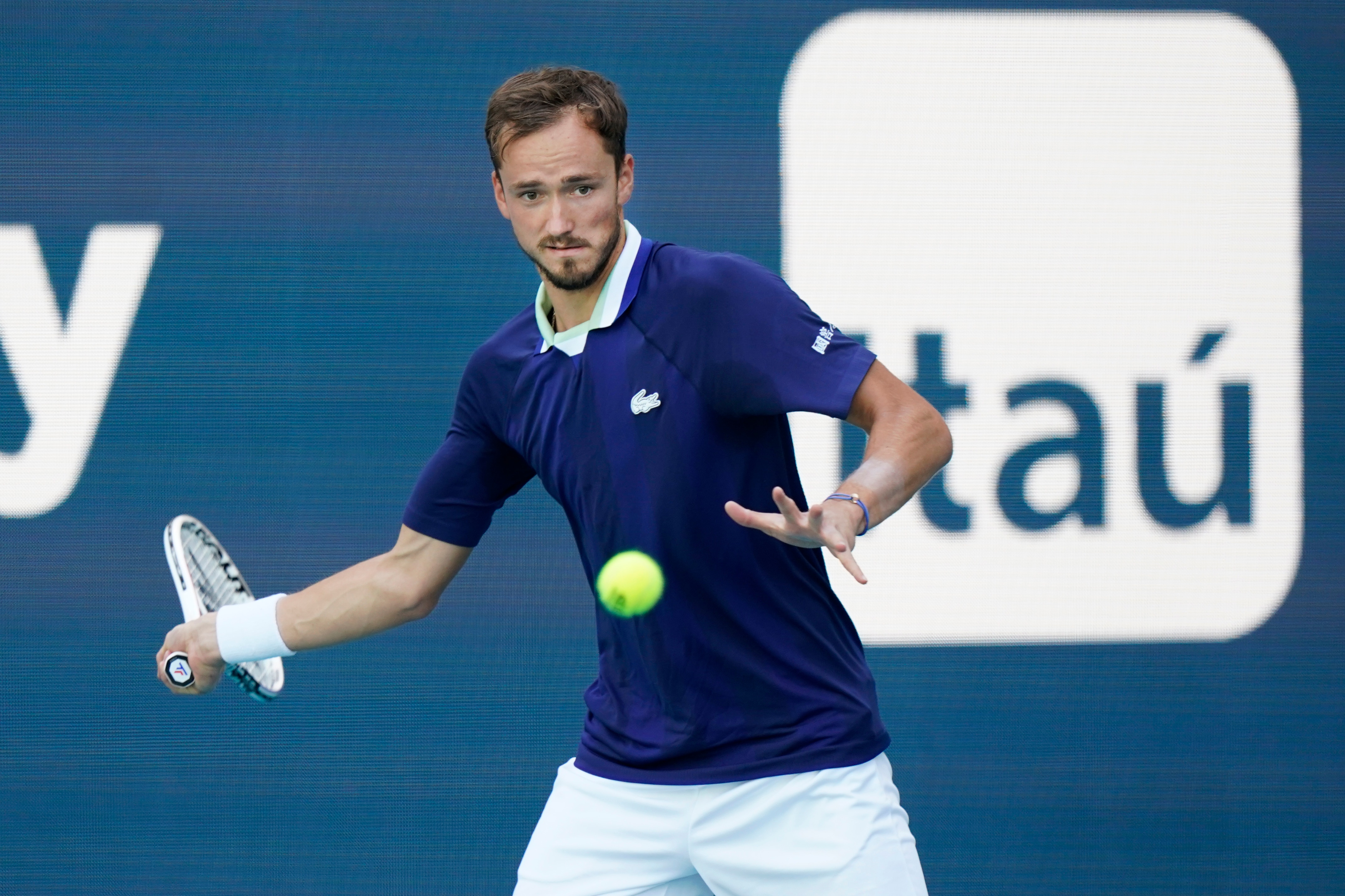 Daniil Medvedev of Russia returns a shot from Jenson Brooksby, during the Miami Open tennis tournament, Tuesday, March 29, 2022, in Miami Gardens, Fla. (AP Photo/Wilfredo Lee)