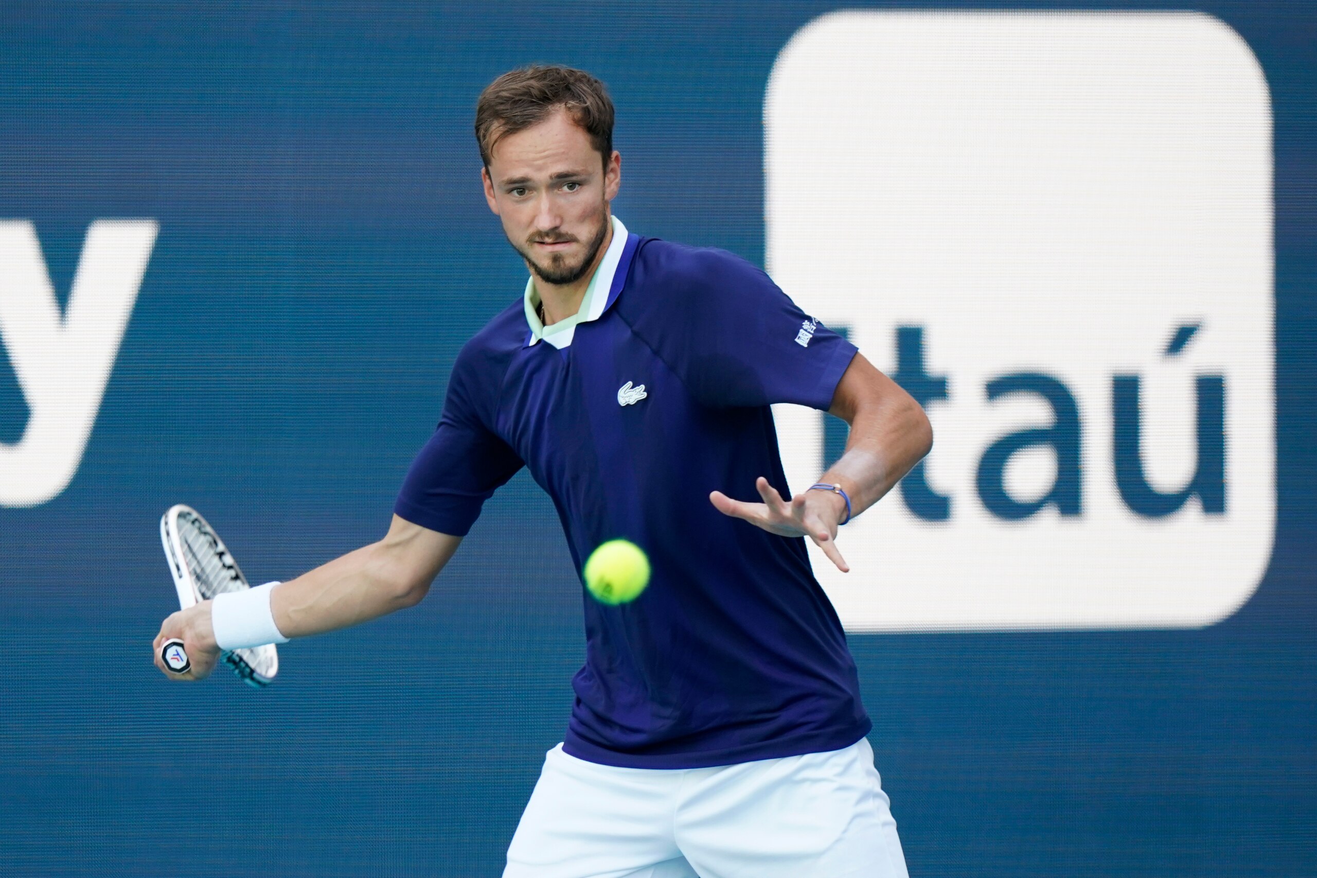 Daniil Medvedev of Russia returns a shot from Jenson Brooksby, during the Miami Open tennis tournament, Tuesday, March 29, 2022, in Miami Gardens, Fla. (AP Photo/Wilfredo Lee)