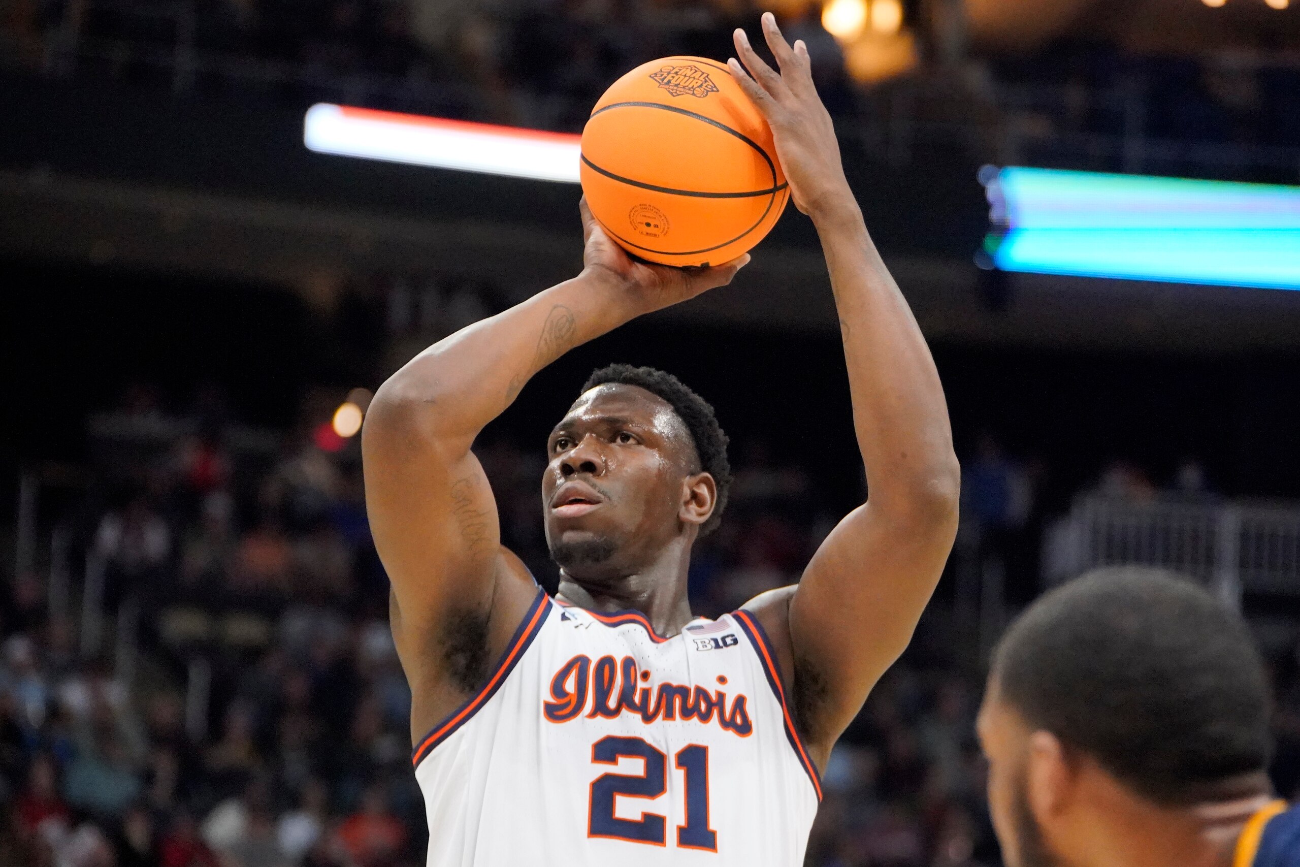 Illinois 's Kofi Cockburn (21) takes a foul shot during the first half of a college basketball game against Chattanooga in the first round of the NCAA men's tournament in Pittsburgh, Friday, March 18, 2022. (AP Photo/Gene J. Puskar)