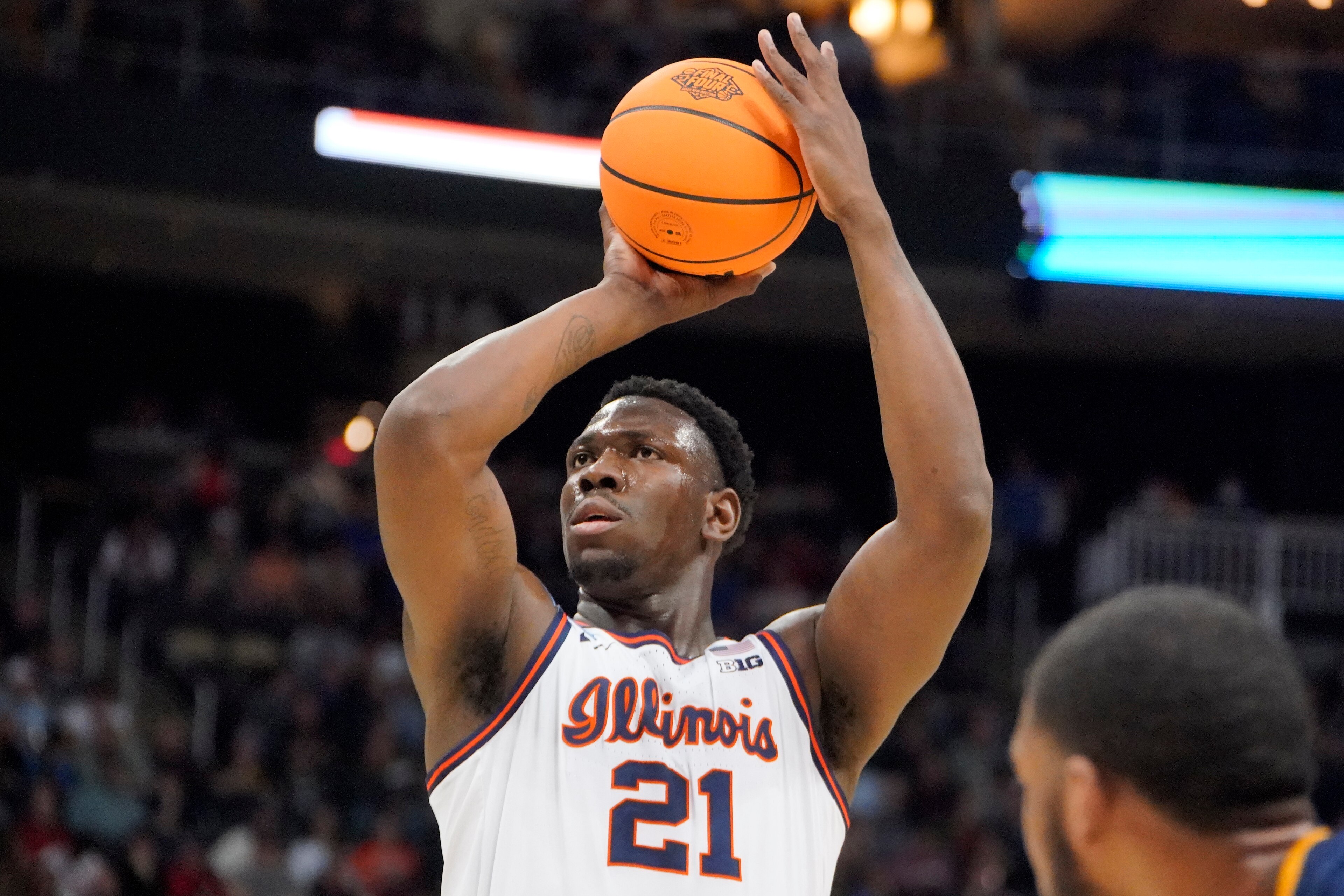 Illinois 's Kofi Cockburn (21) takes a foul shot during the first half of a college basketball game against Chattanooga in the first round of the NCAA men's tournament in Pittsburgh, Friday, March 18, 2022. (AP Photo/Gene J. Puskar)