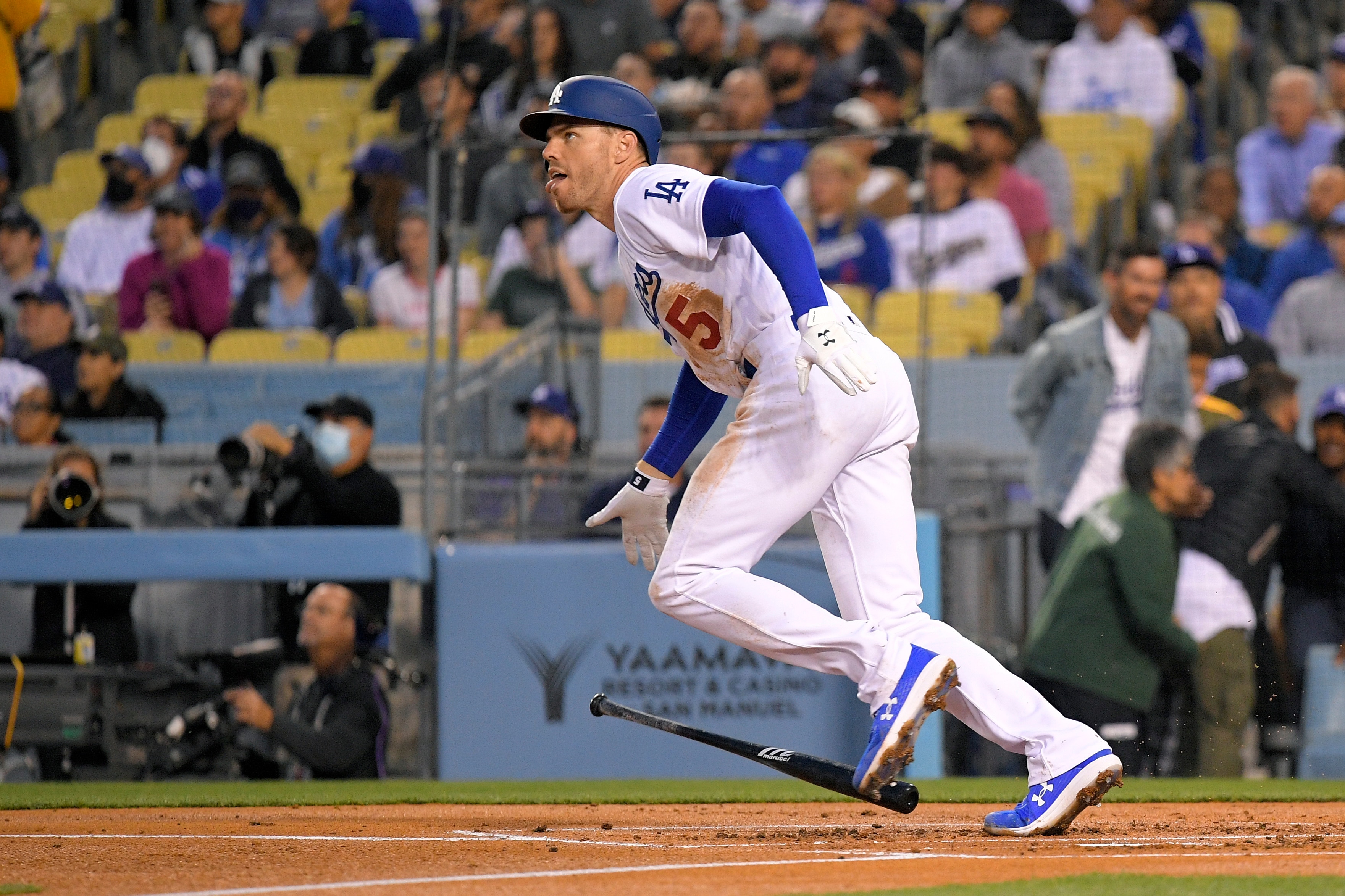 Los Angeles Dodgers' Freddie Freeman drops hit bat as he hits a solo home run during the first inning of a baseball game against the Atlanta Braves Monday, April 18, 2022, in Los Angeles. (AP Photo/Mark J. Terrill)
