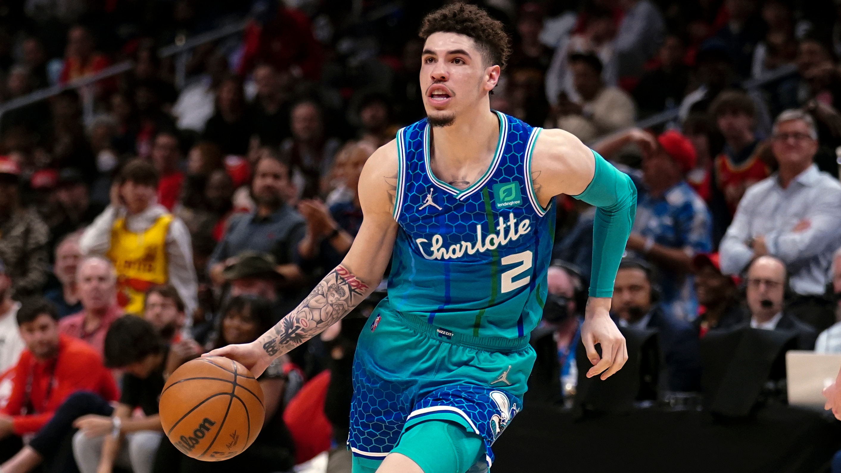 Charlotte Hornets guard LaMelo Ball (2) works against the Atlanta Hawks in the second half of an NBA play-in basketball game Wednesday, April 13, 2022, in Atlanta. (AP Photo/John Bazemore)