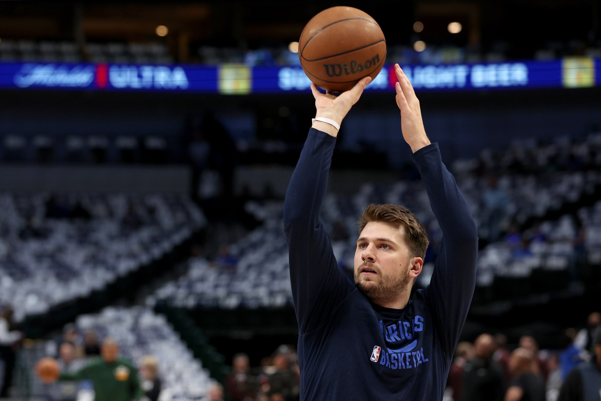 DALLAS, TEXAS - APRIL 18: Luka Doncic #77 of the Dallas Mavericks shoots the ball while working out prior to Game Two of the Western Conference First Round NBA Playoffs at American Airlines Center on April 18, 2022 in Dallas, Texas. NOTE TO USER: User expressly acknowledges and agrees that, by downloading and or using this photograph, User is consenting to the terms and conditions of the Getty Images License Agreement. (Photo by Tom Pennington/Getty Images) DALLAS, TEXAS - APRIL 18: Luka Doncic #77 of the Dallas Mavericks shoots the ball while working out prior to Game Two of the Western Conference First Round NBA Playoffs at American Airlines Center on April 18, 2022 in Dallas, Texas. NOTE TO USER: User expressly acknowledges and agrees that, by downloading and or using this photograph, User is consenting to the terms and conditions of the Getty Images License Agreement. (Photo by Tom Pennington/Getty Images)