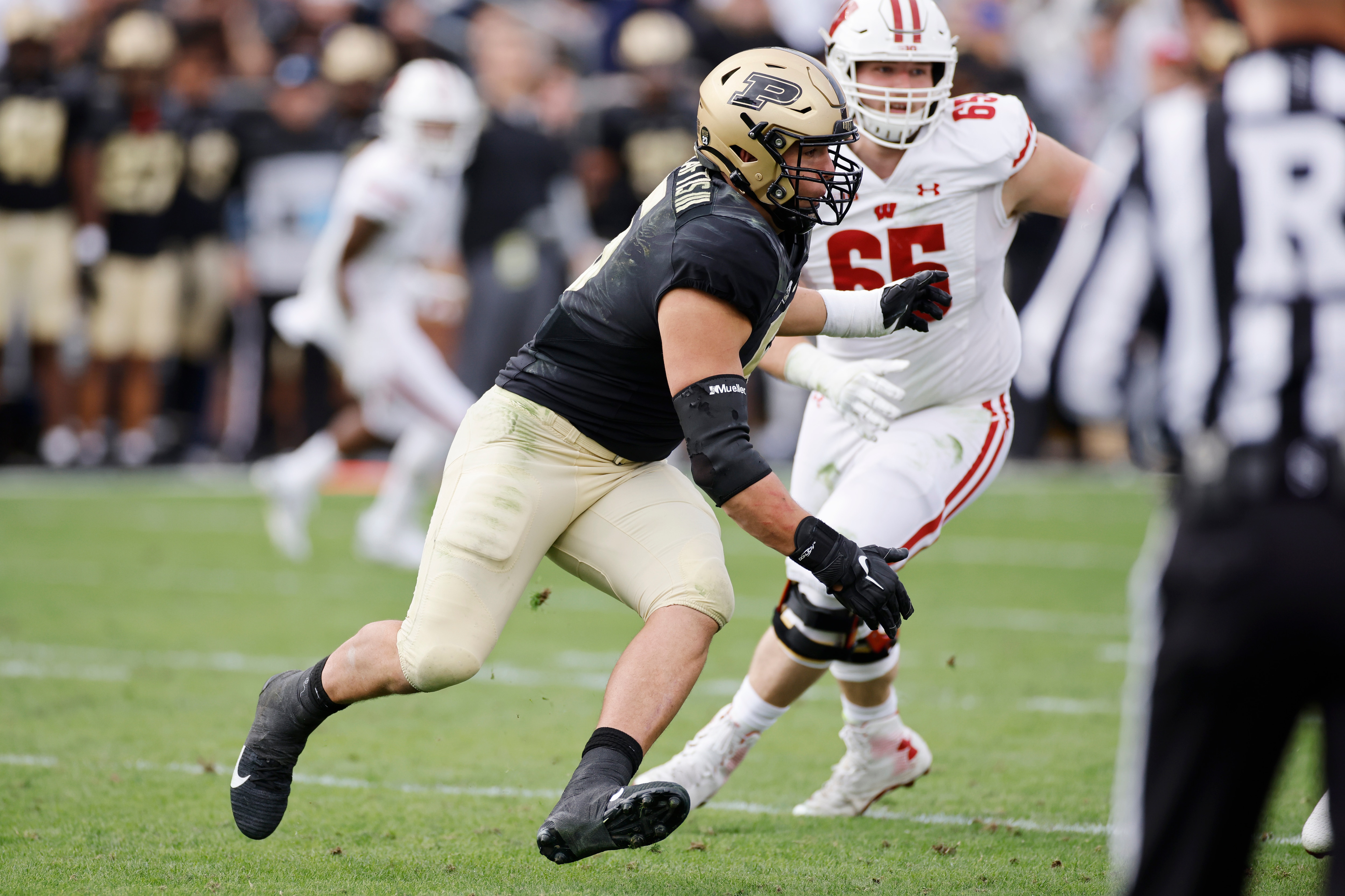 WEST LAFAYETTE, IN - OCTOBER 23: Purdue Boilermakers defensive end George Karlaftis (5) rushes on defense during a college football game against the Wisconsin Badgers on Oct. 23, 2021 at Ross-Ade Stadium in West Lafayette, Indiana. (Photo by Joe Robbins/Icon Sportswire via Getty Images)